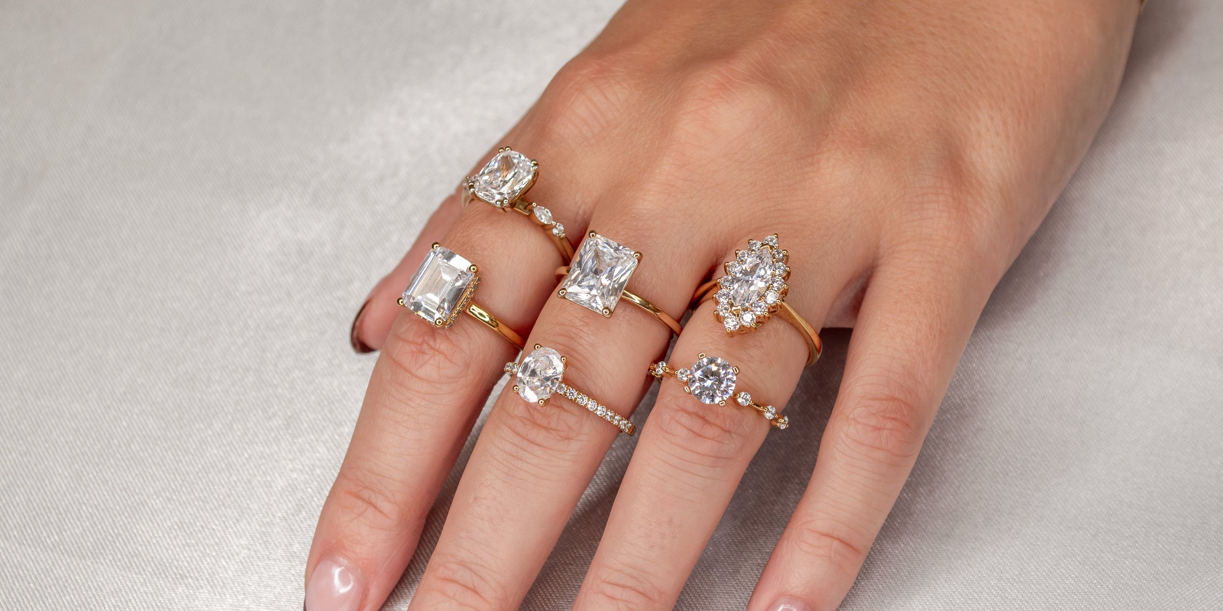 Various shapes of diamond engagement rings on model | Lisa Robin