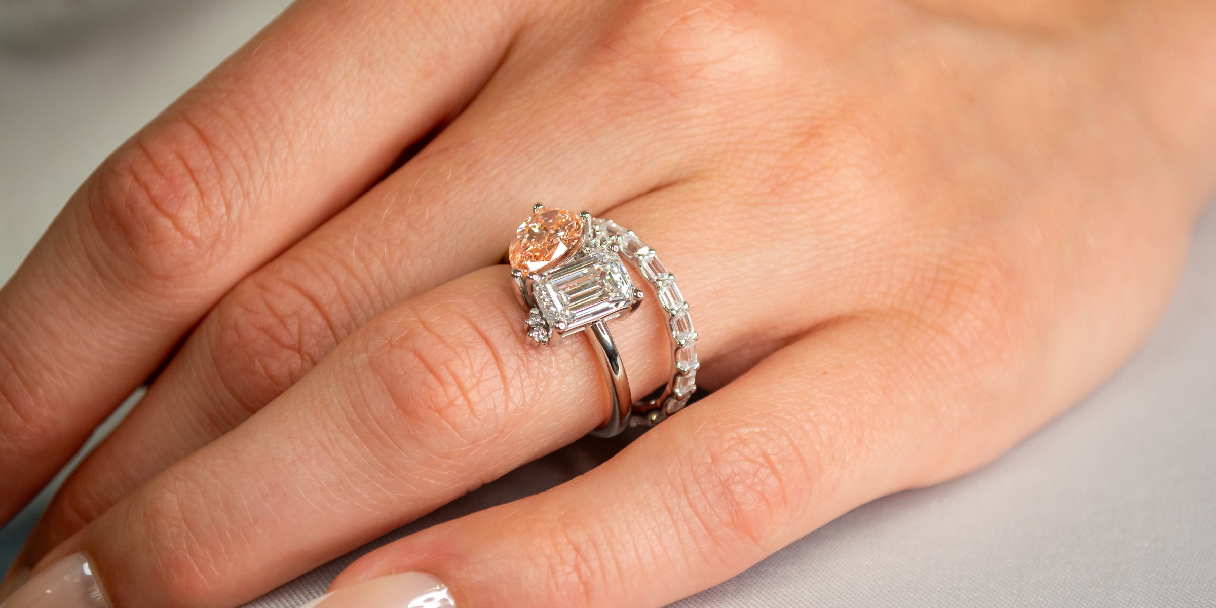 Sage emrald cut diamond with pink pear diamond and Finley marquise east west wedding ring | Lisa Robin