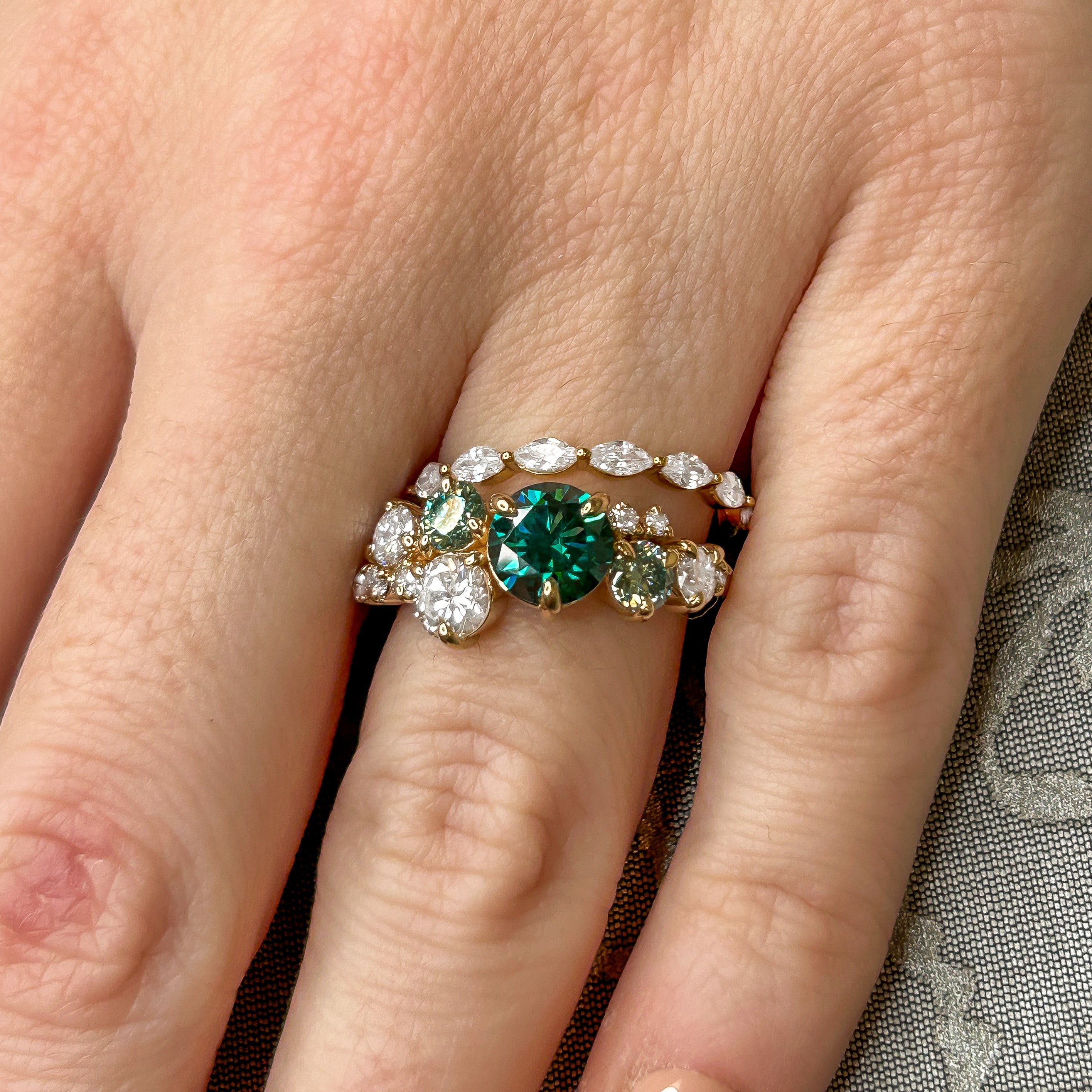 The Chloe Emerald Center and Diamond and Emerald Accent Cluster Engagement Ring