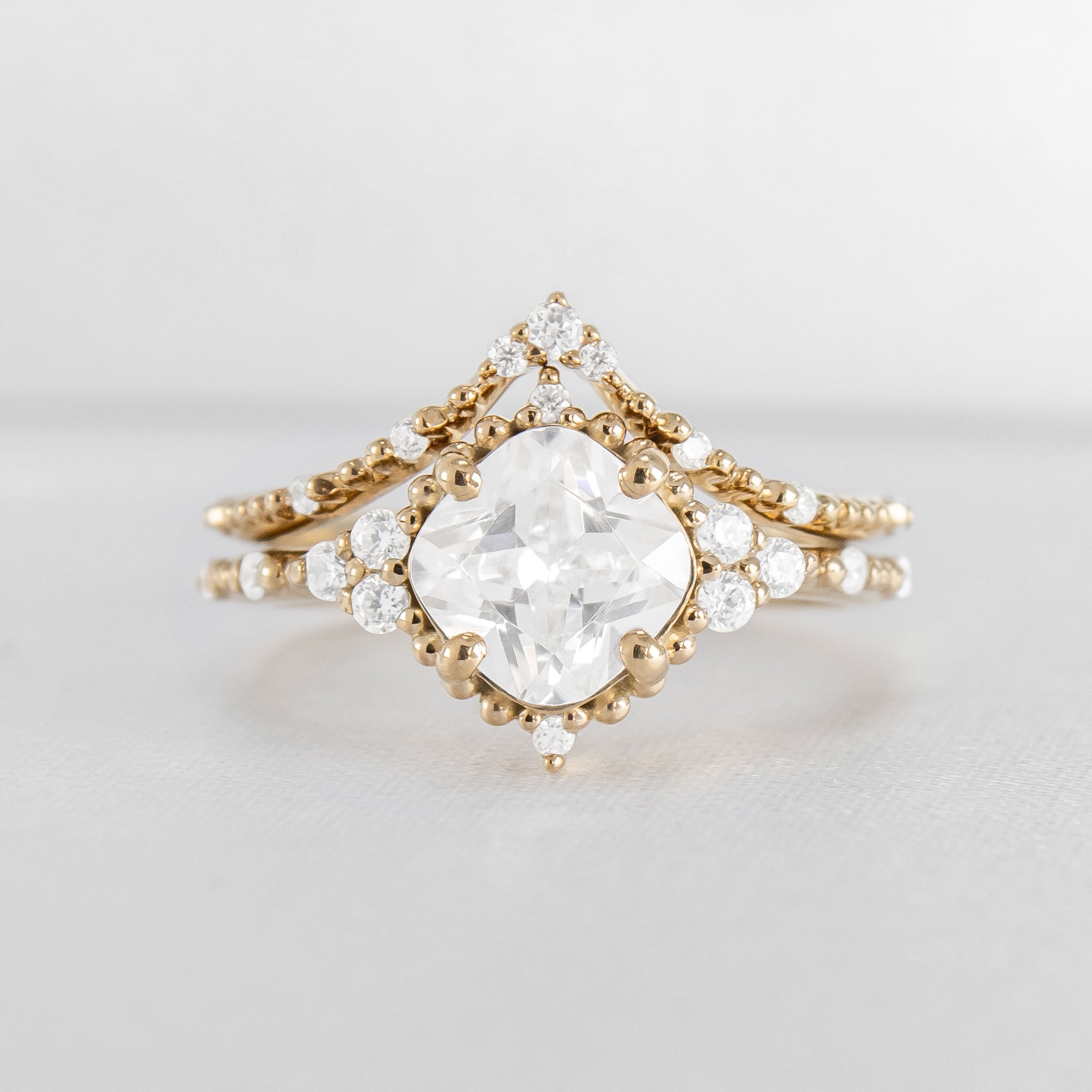 Shown in 2 Carat Diamond*The Galaeth Cluster Diamond Engagement Ring with cushion cut diamond in yellow gold with the Maeve curved lab diamond 14K yellow gold wedding band by Lisa Robin#color_14k-yellow-gold
