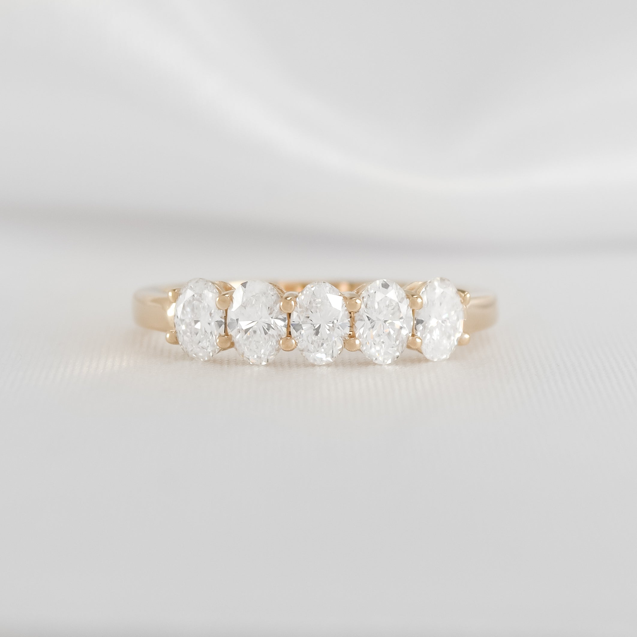 The Guthrie 5 Stone Oval Diamond Wedding Ring in 14K yellow gold from front by Lisa Robin#color_14k-yellow-gold