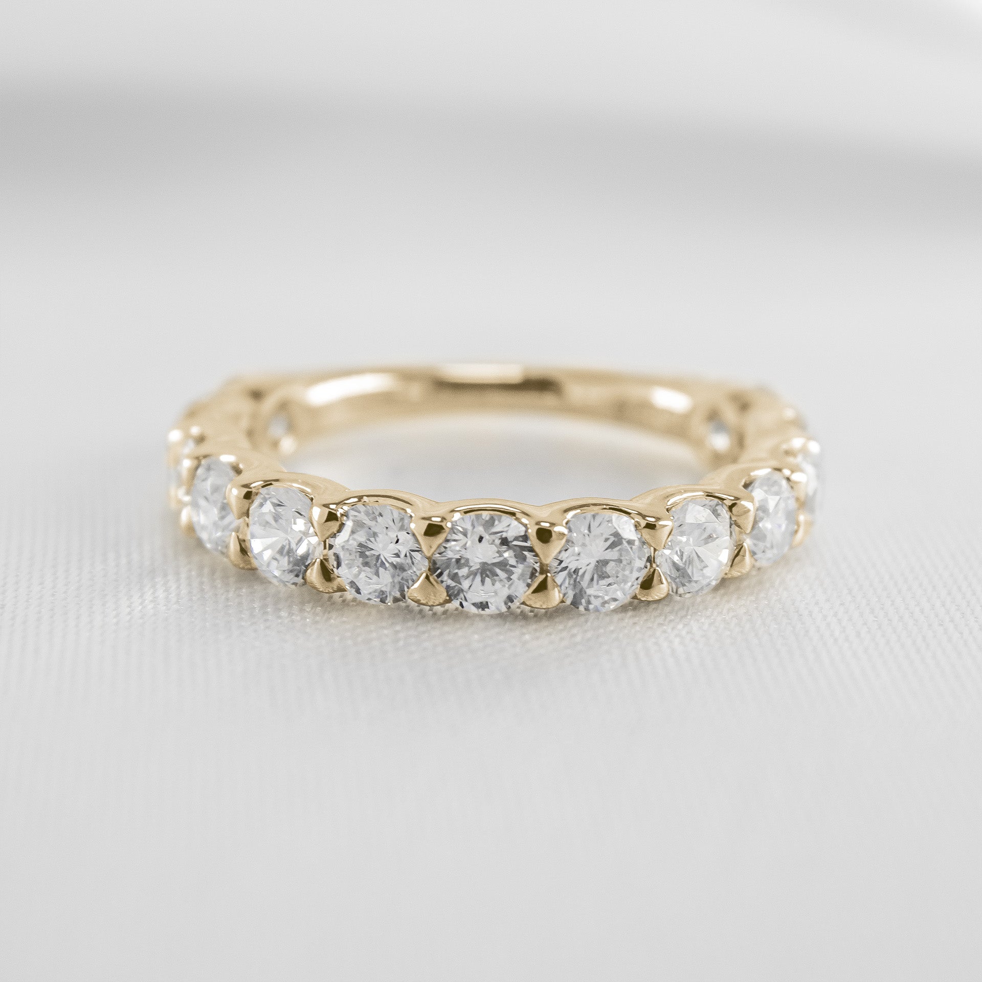 Shown in 1 carat * The Harper round 13-stone eternity diamond wedding band | Lisa Robin#color_10k-yellow-gold
