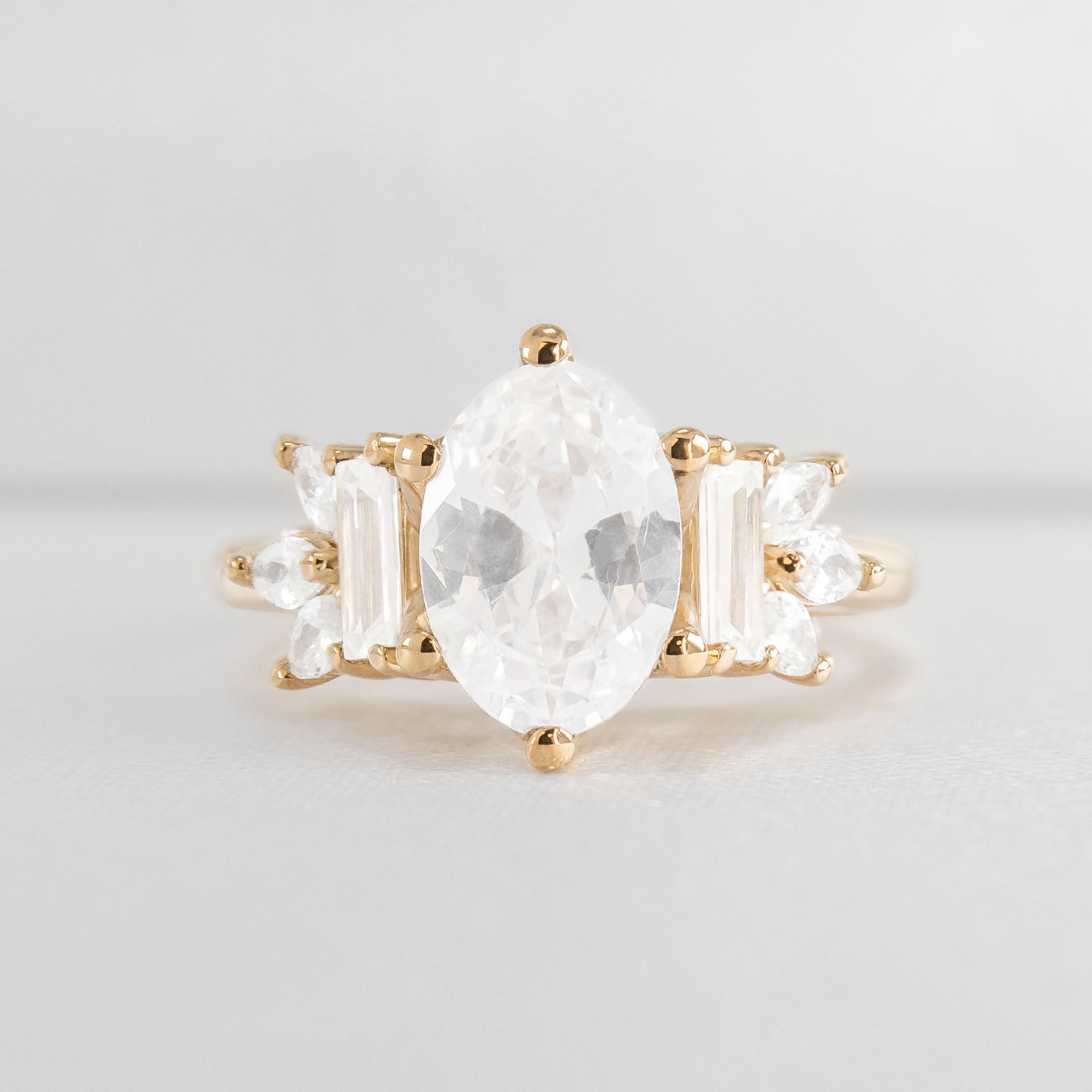 Shown in 3 Carat Diamond*The Juniper Baguette and Marquise Diamond Engagement Ring with oval cut diamond in yellow gold from front by Lisa Robin#color_14k-yellow-gold