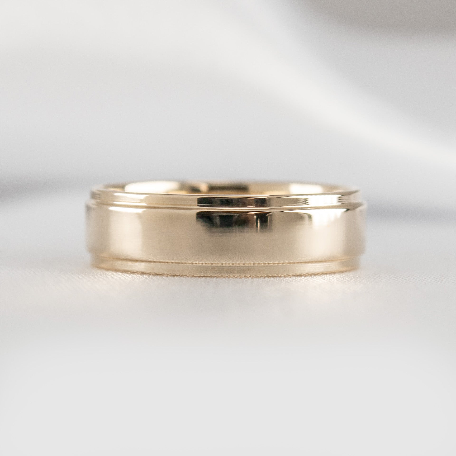 The Kennedy flat step edge Wedding Ring in 14K yellow gold from front by Lisa Robin#color_14k-yellow-gold