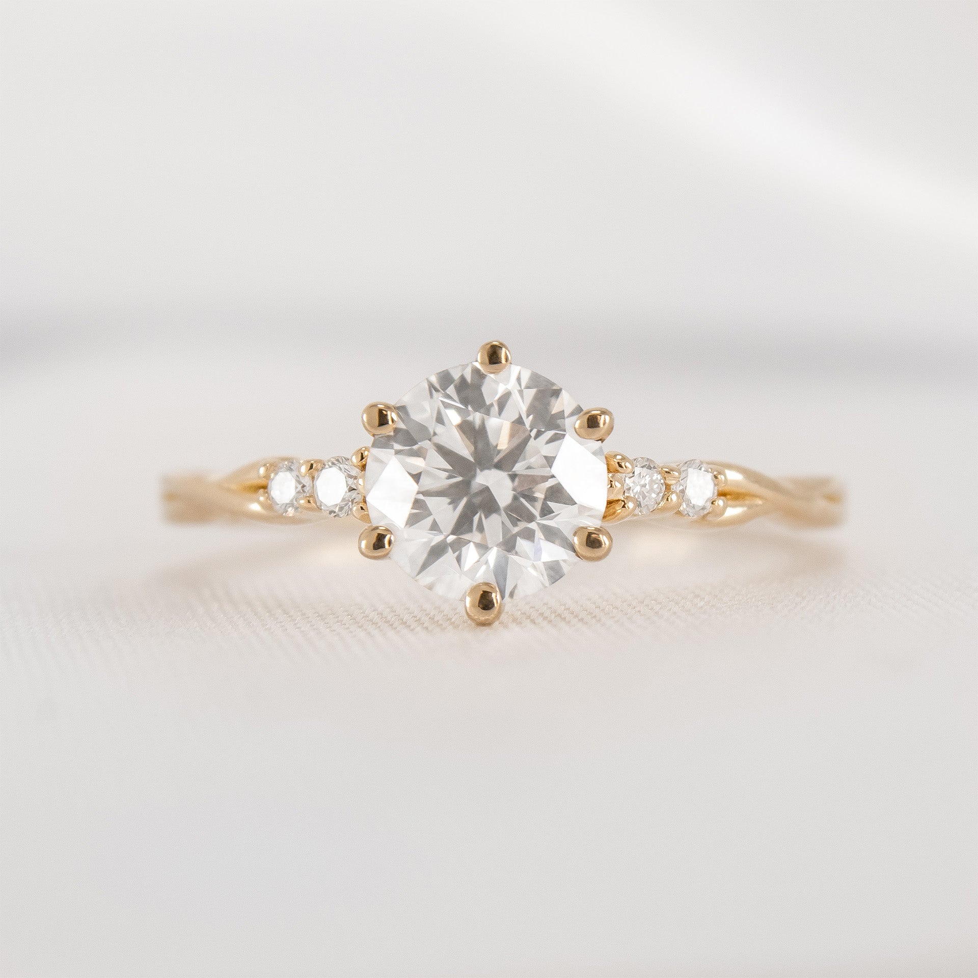 Shown in 1.5 Carat Diamond*The Liana delicate twist Diamond Engagement Ring with round cut diamond in yellow gold from front by Lisa Robin#color_14k-yellow-gold