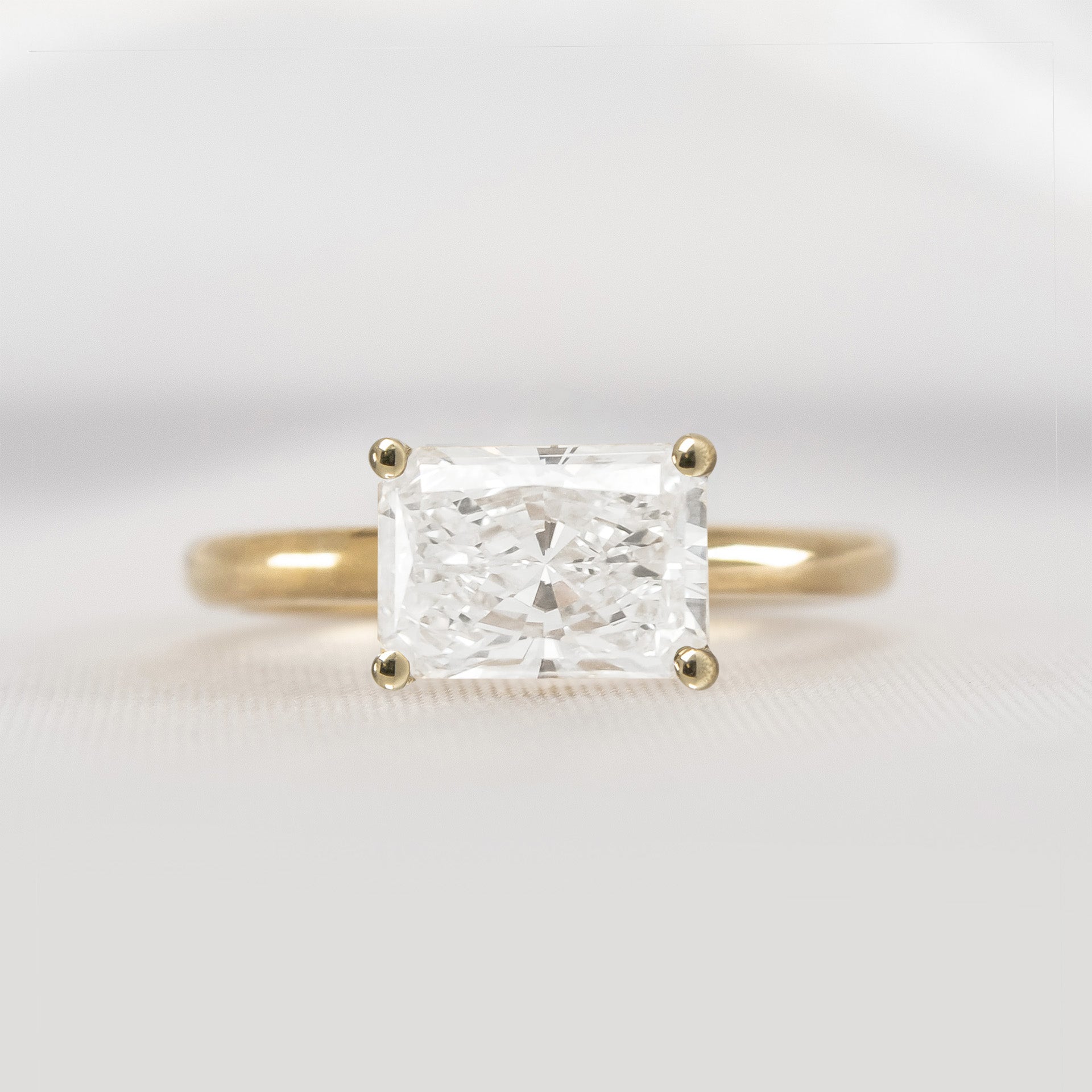 Shown in 1.75 Carat * The Mia East West Diamond Solitaire Engagement Ring | Lisa Robin#color_14k-yellow-gold