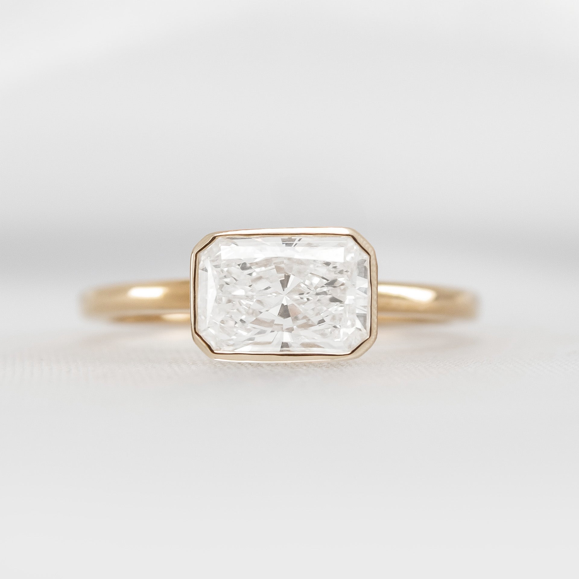 Shown in 1.75 Carat * The Nova Bezel East West Diamond Ring | Lisa Robin#color_14k-yellow-gold