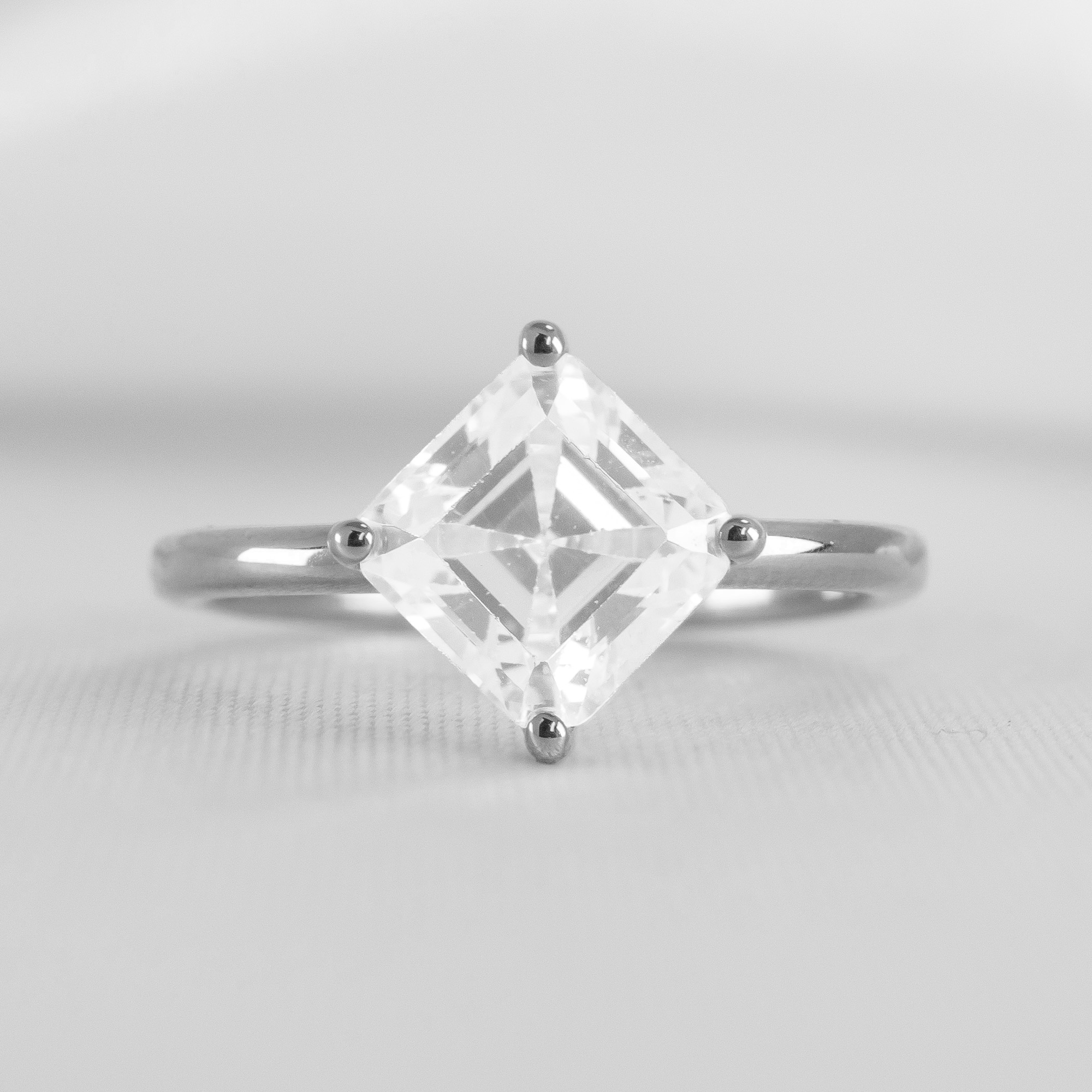 Shown in 2 Carat Diamond*The Stella Compass Set Solitaire Engagement Ring with asscher cut diamond in platinum from the front by Lisa Robin#color_platinum