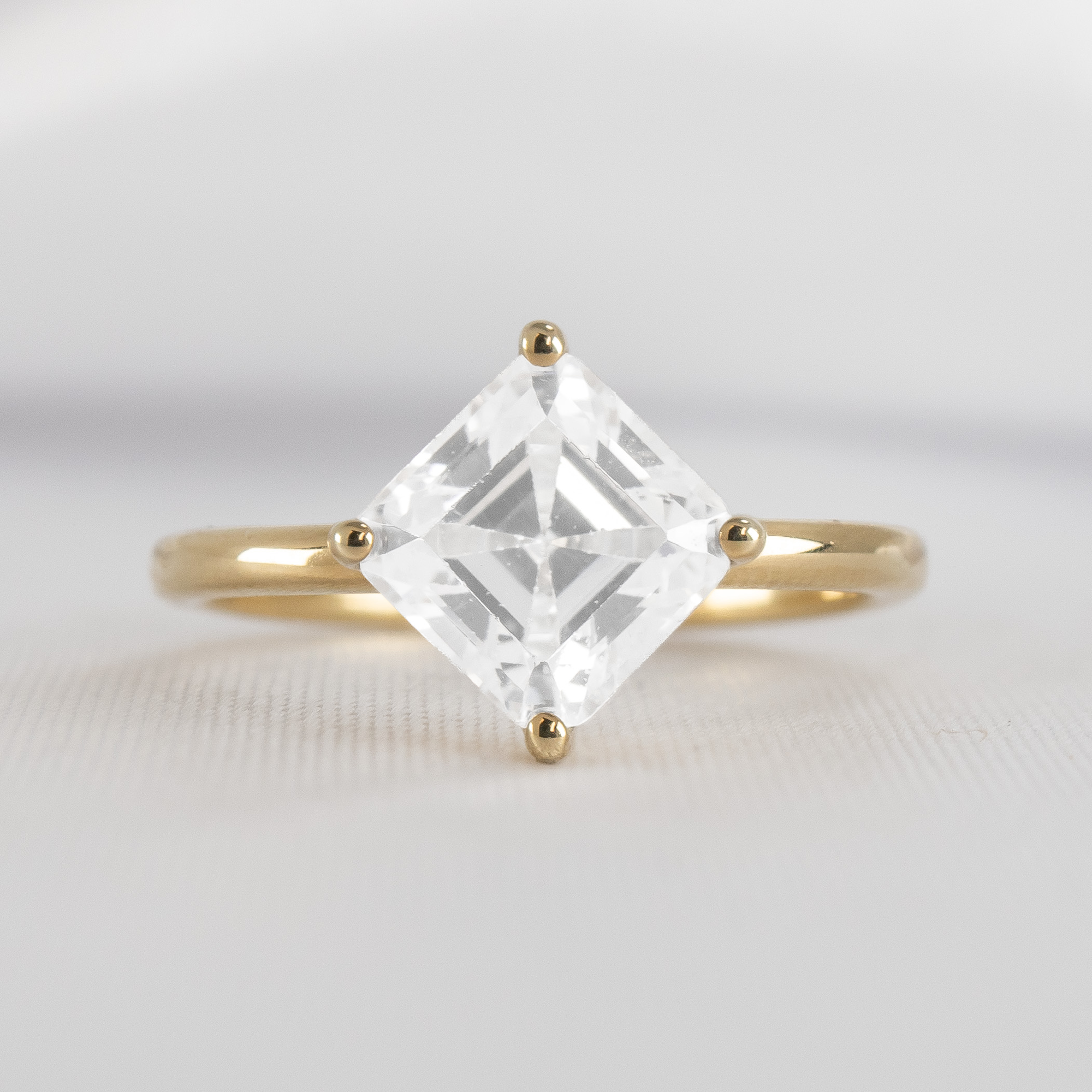 Shown in 2 Carat Diamond*The Stella Compass Set Solitaire Engagement Ring with asscher cut diamond in yellow gold from the front by Lisa Robin#color_14k-yellow-gold