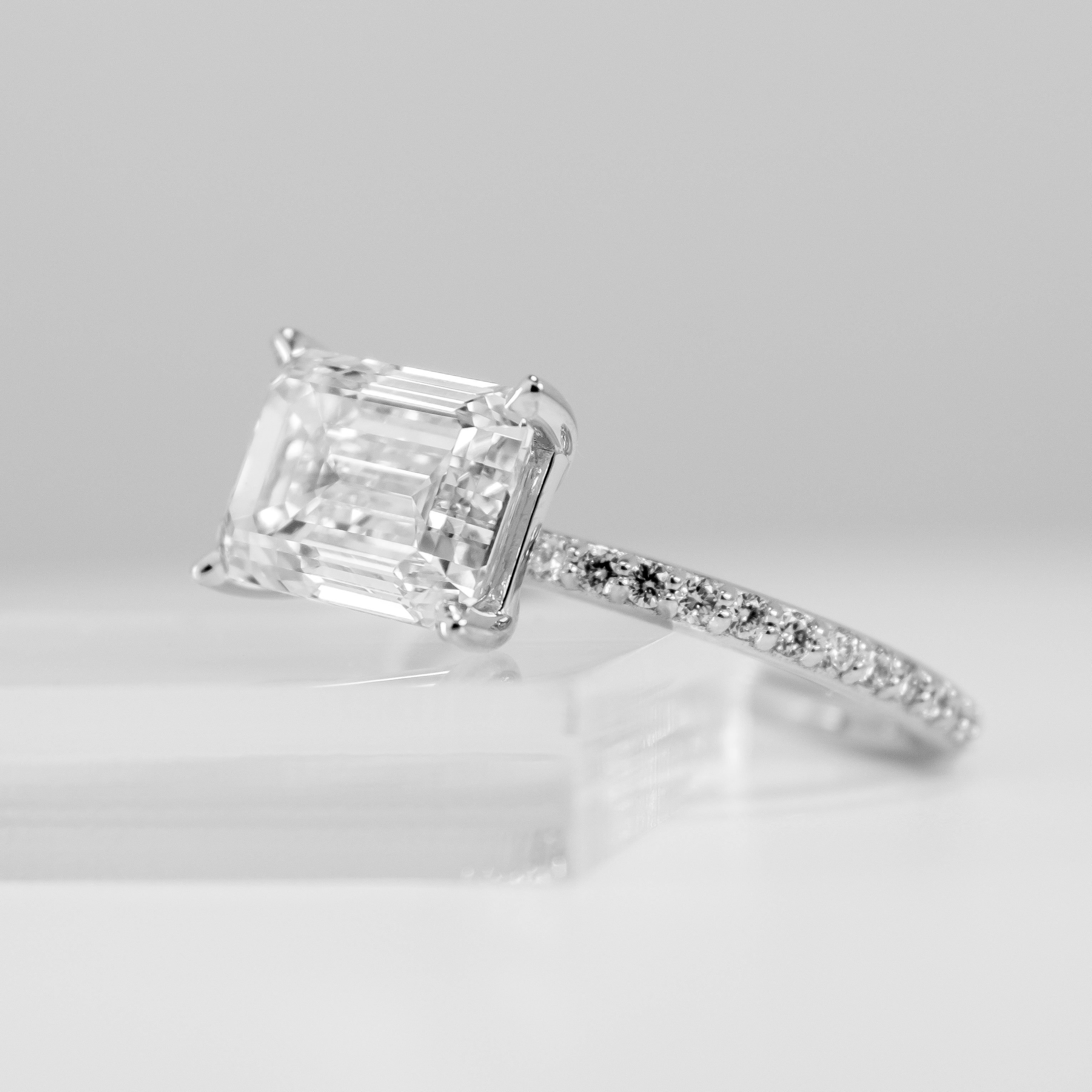 The Adelaide Emerald Cut Diamond East West Pavé Ring