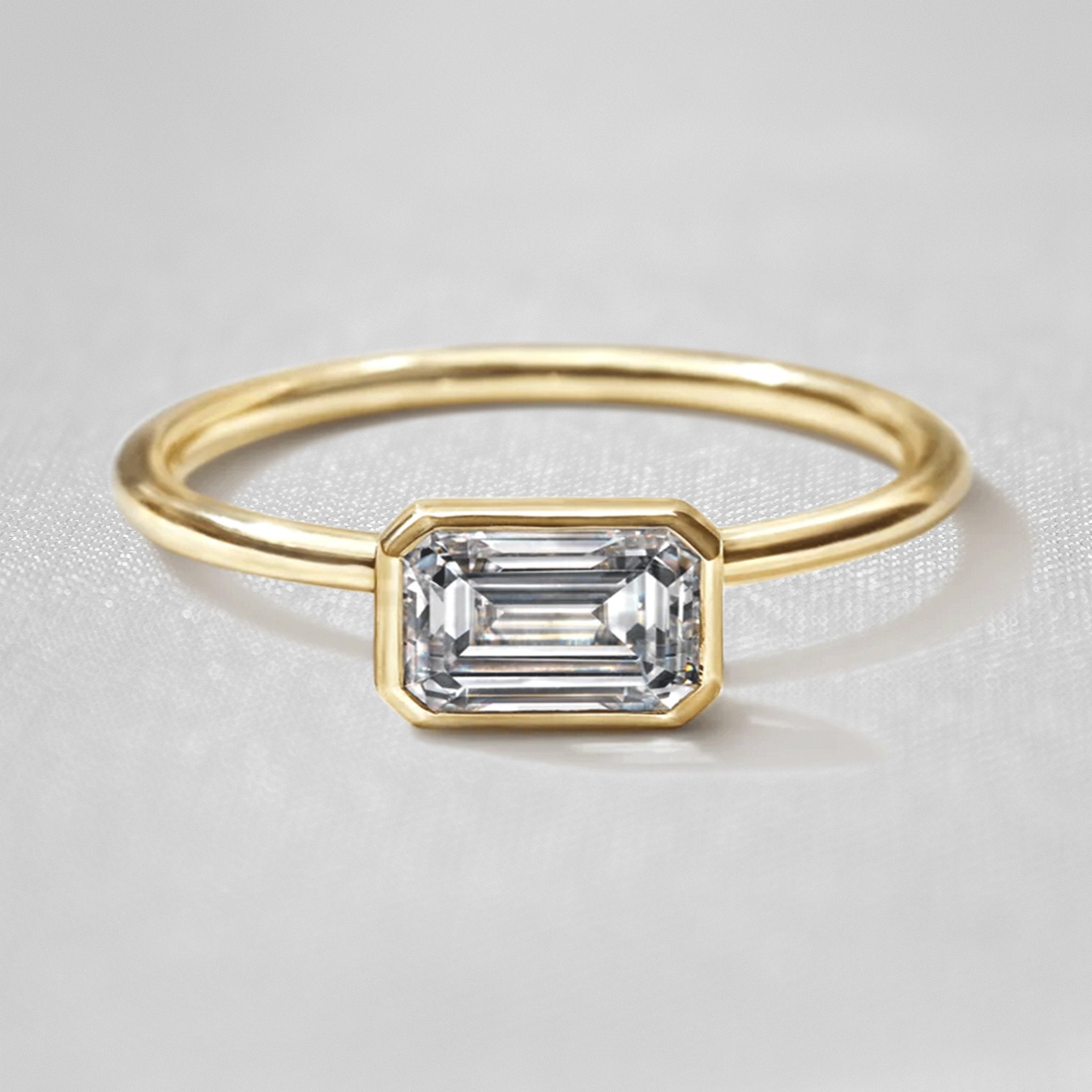 Shown in 1.0 Carat " The Nova East West Bezel Diamond Engagement Ring - Lisa Robin#color_18k-yellow-gold