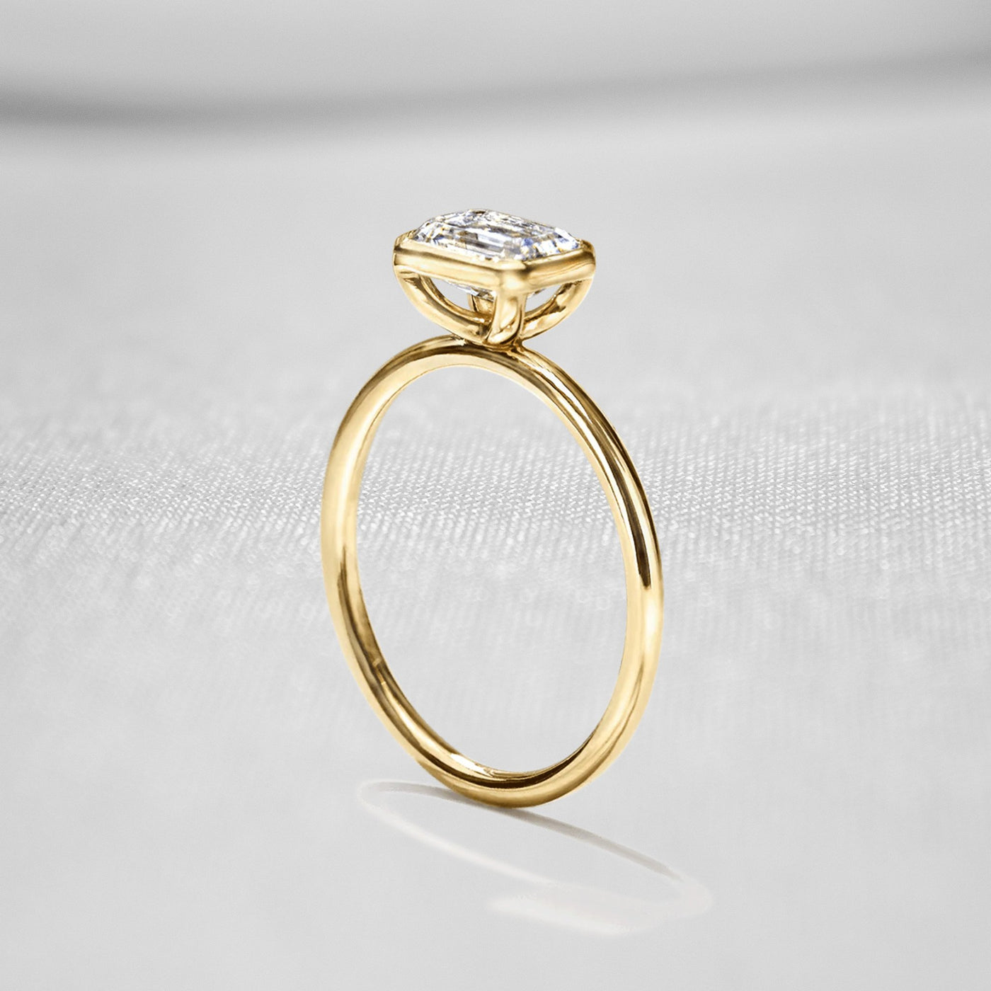 Shown in 1.0 Carat " The Nova East West Bezel Diamond Engagement Ring - Lisa Robin#color_18k-yellow-gold