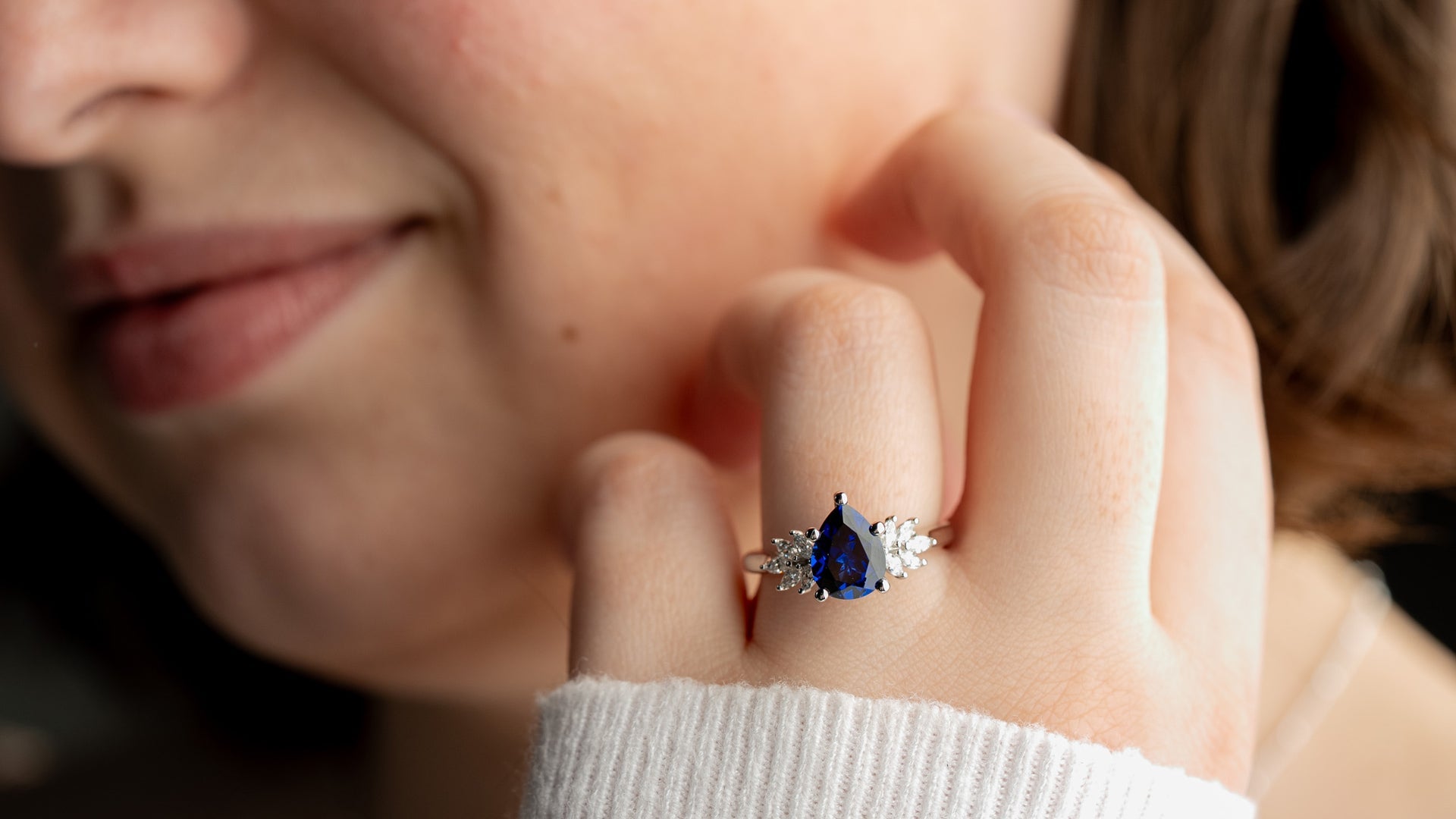 Anna 2 carat blue sapphire diamond cluster engagement ring in white gold on model by Lisa Robin
