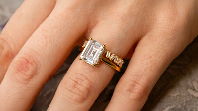 The Blaine baguette eternity band with Mia eats west emerald cut engagement ring on model | Lisa Robin