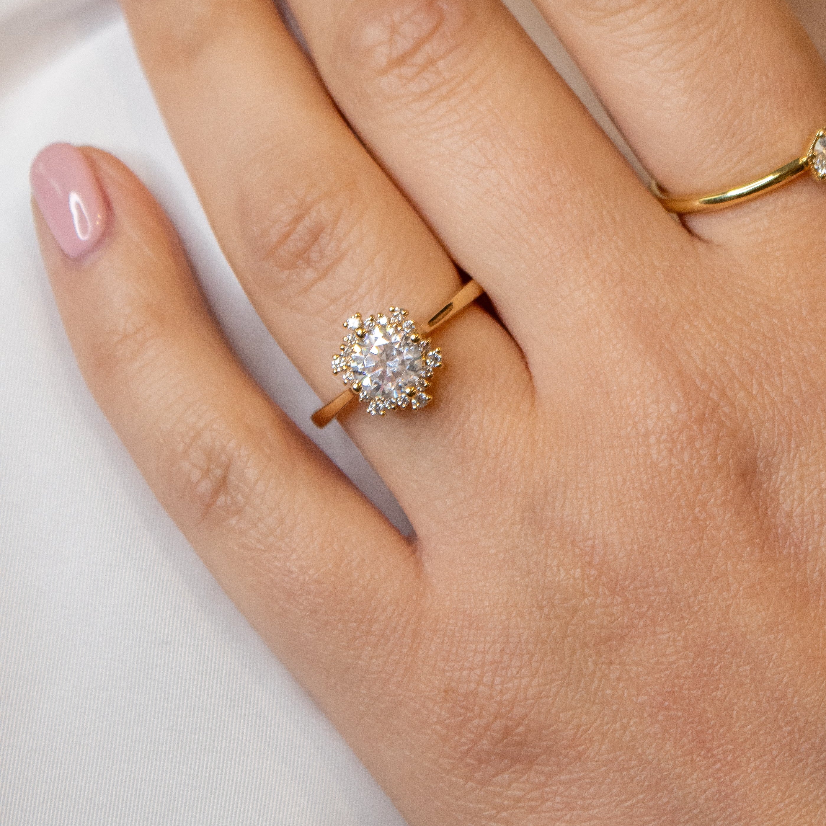 Shown in 1 Carat Diamond*The aatish Halo Engagement Ring with round cut diamond in yellow gold on model hand by Lisa Robin#color_14k-yellow-gold