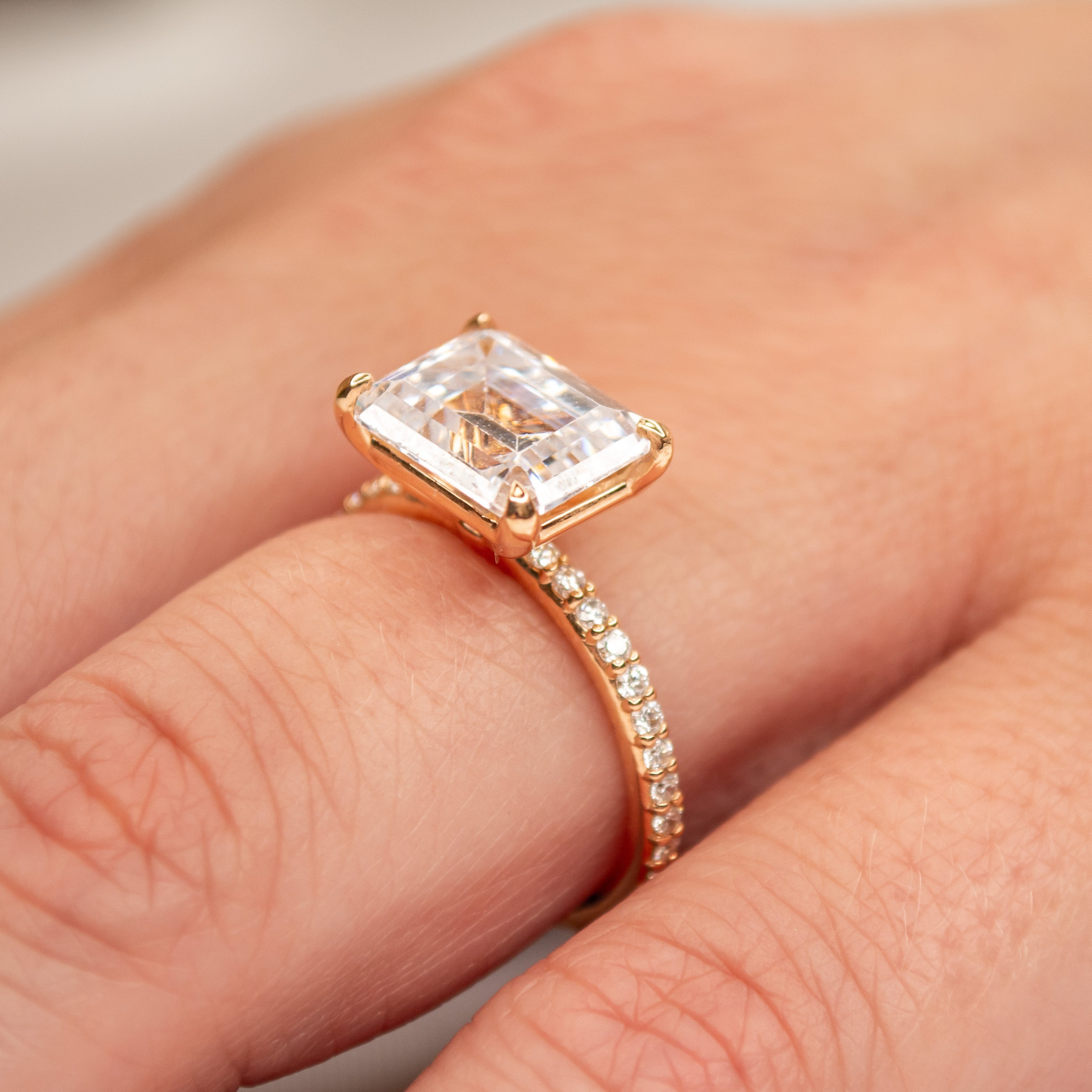 Shown in 4.0 carat * The Adelaide Emerald Cut Diamond East West Pave Ring | Lisa Robin#color_14k-rose-gold