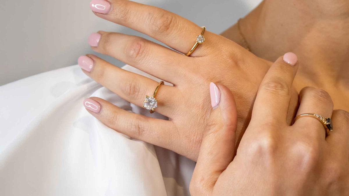 Allison round diamond solitaire engagement ring on model by Lisa Robin