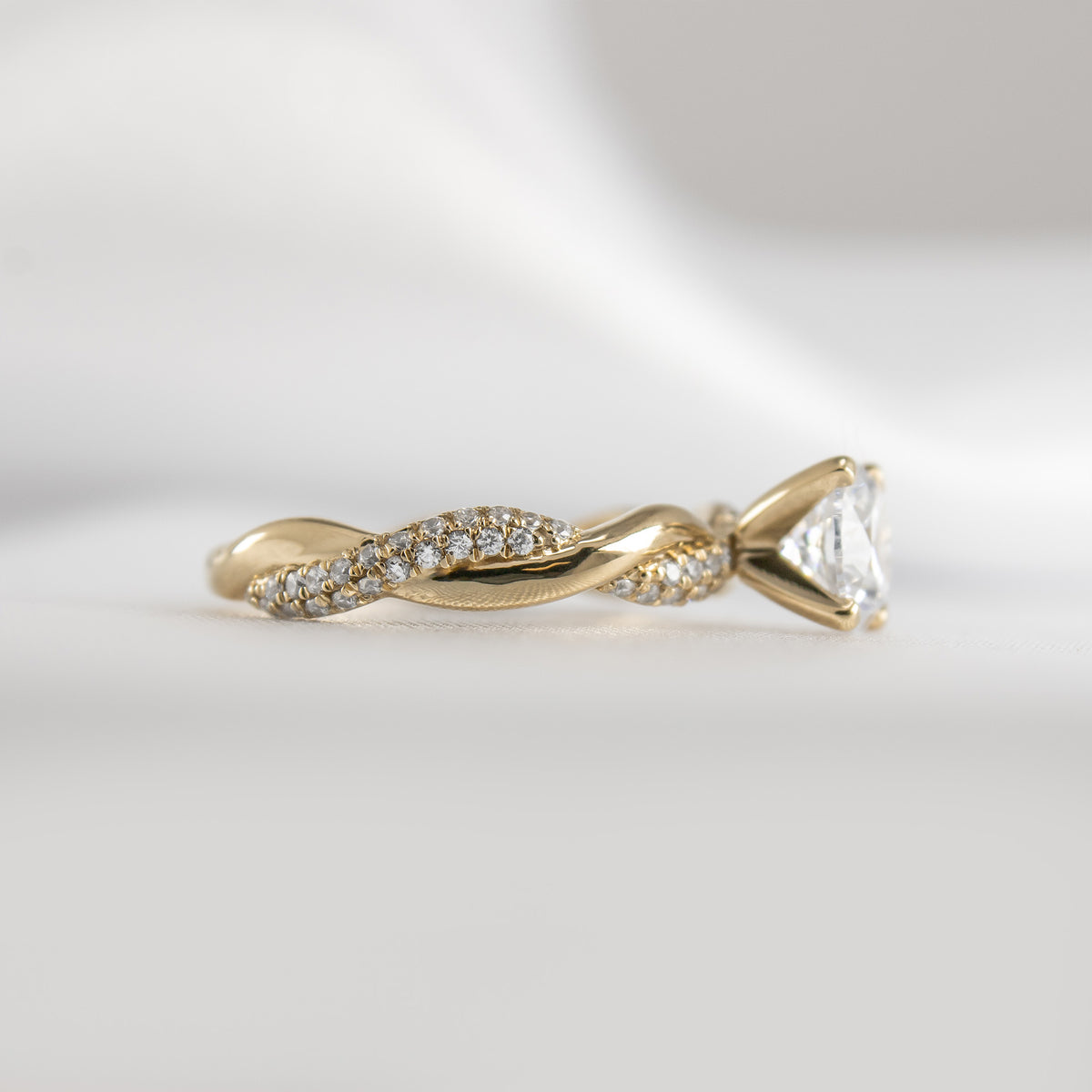 Shown in 1.0 Carat Diamond*The Amelia Twist Engagement Ring with round cut diamond in yellow gold from side by Lisa Robin#color_14k-yellow-gold#shape_round