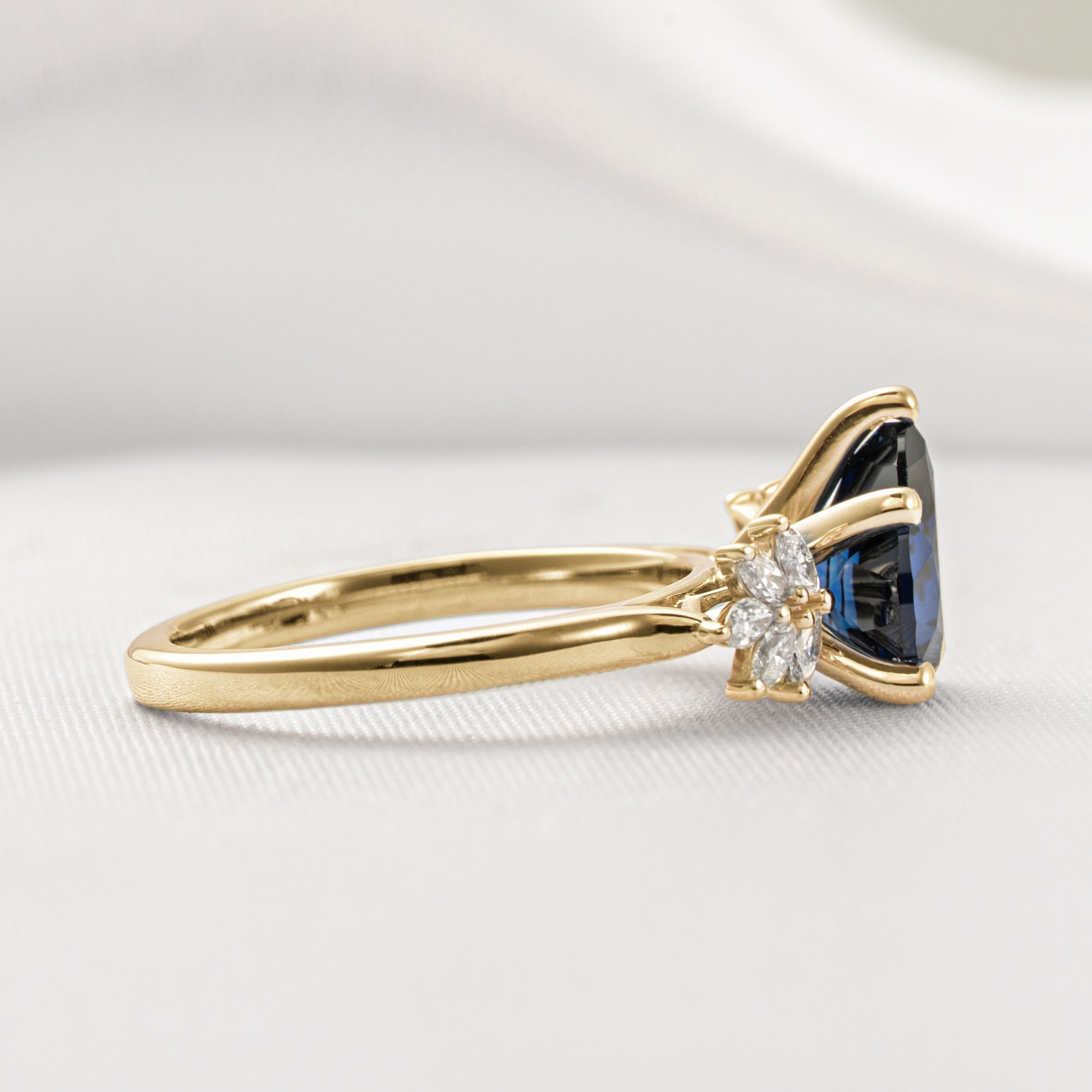 Shown in 2.25 Carat Blue Sapphire*The Anna sapphire and cluster diamond Engagement Ring with pear cut in yellow gold from front by Lisa Robin#color_14k-yellow-gold