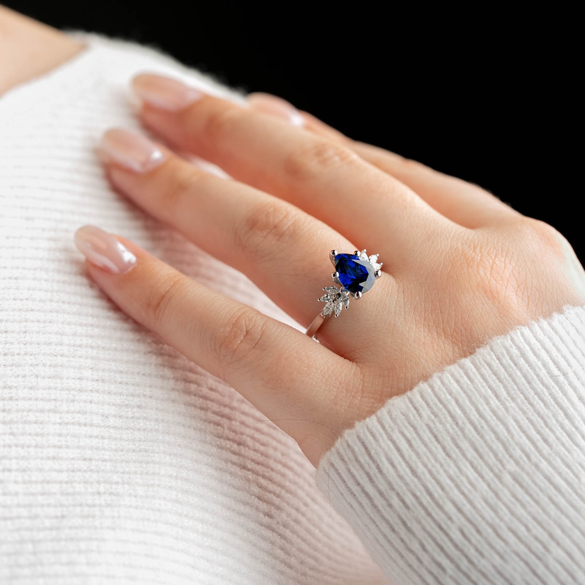 Shown in 2.0 Carat Diamond*The Anna Sapphire Diamond Engagement Ring with pear cut diamond in white gold on model hand by Lisa Robin#color_14k-white-gold