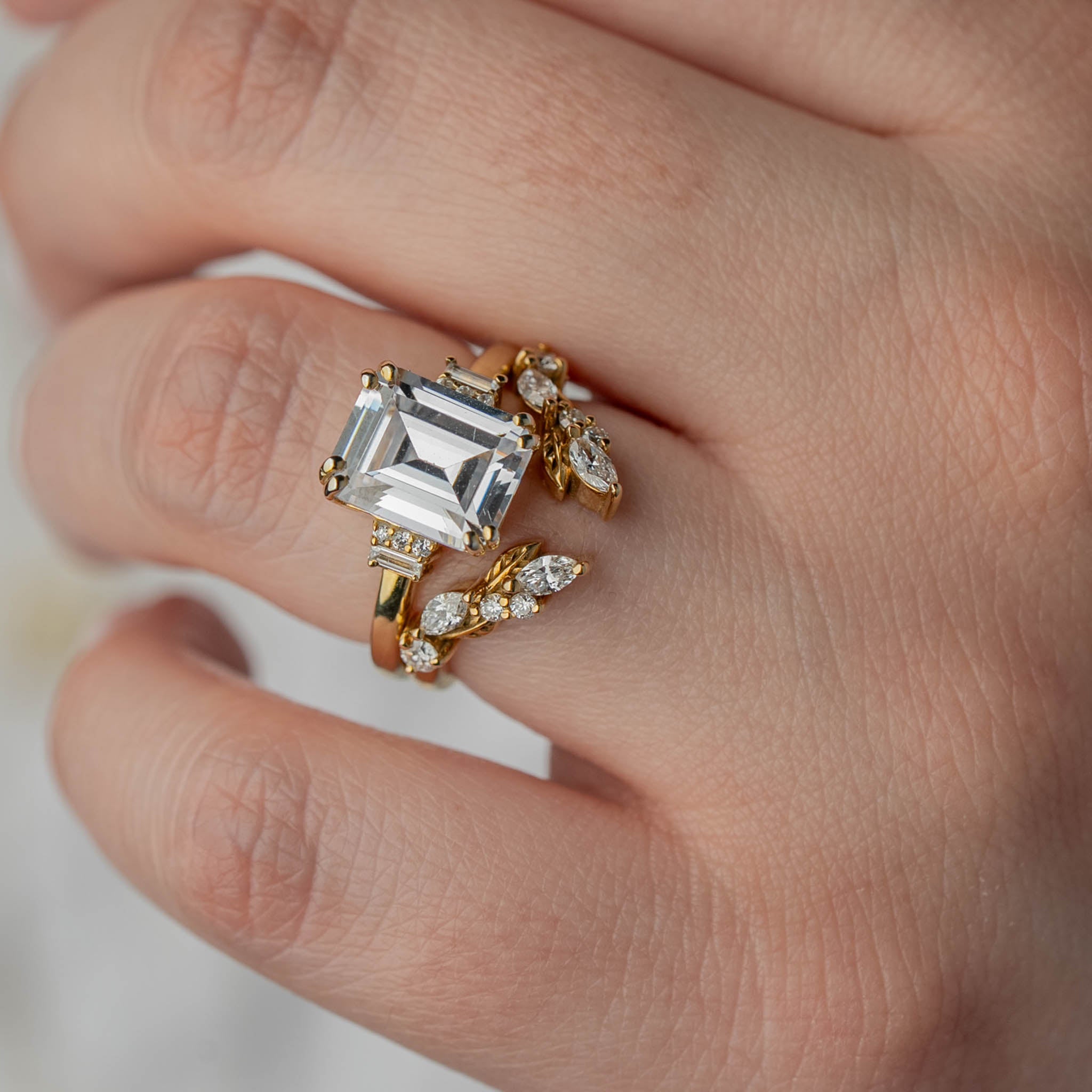 Shown in 1.5 Carat Diamond*The Aston Art Deco Style Engagement Ring with emerald cut diamond in yellow gold on model hand by Lisa Robin#color_14k-yellow-gold