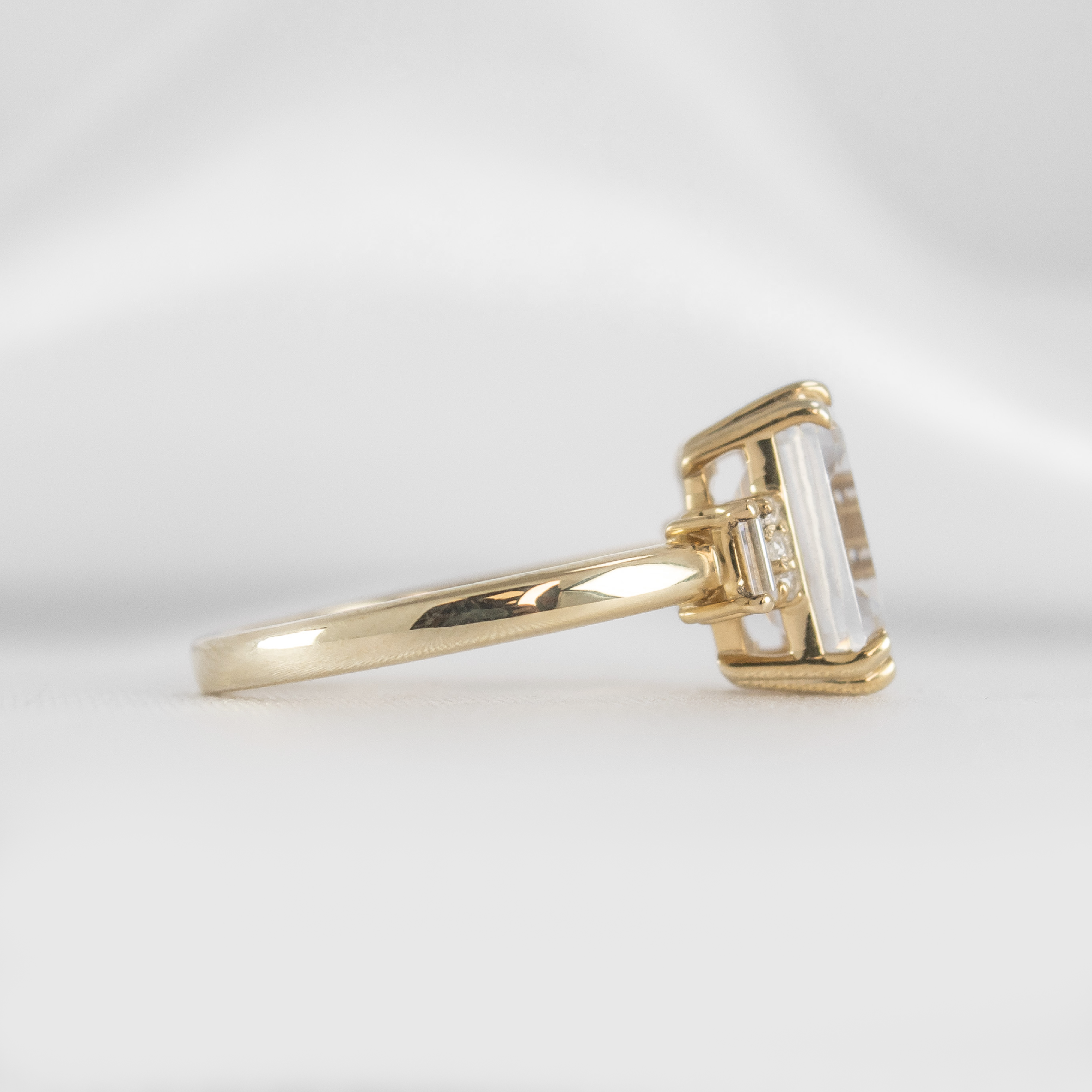 Shown in 1.5 Carat Diamond*The Aston Art Deco Engagement Ring with emerald cut diamond in yellow gold from the side by Lisa Robin#color_14k-yellow-gold
