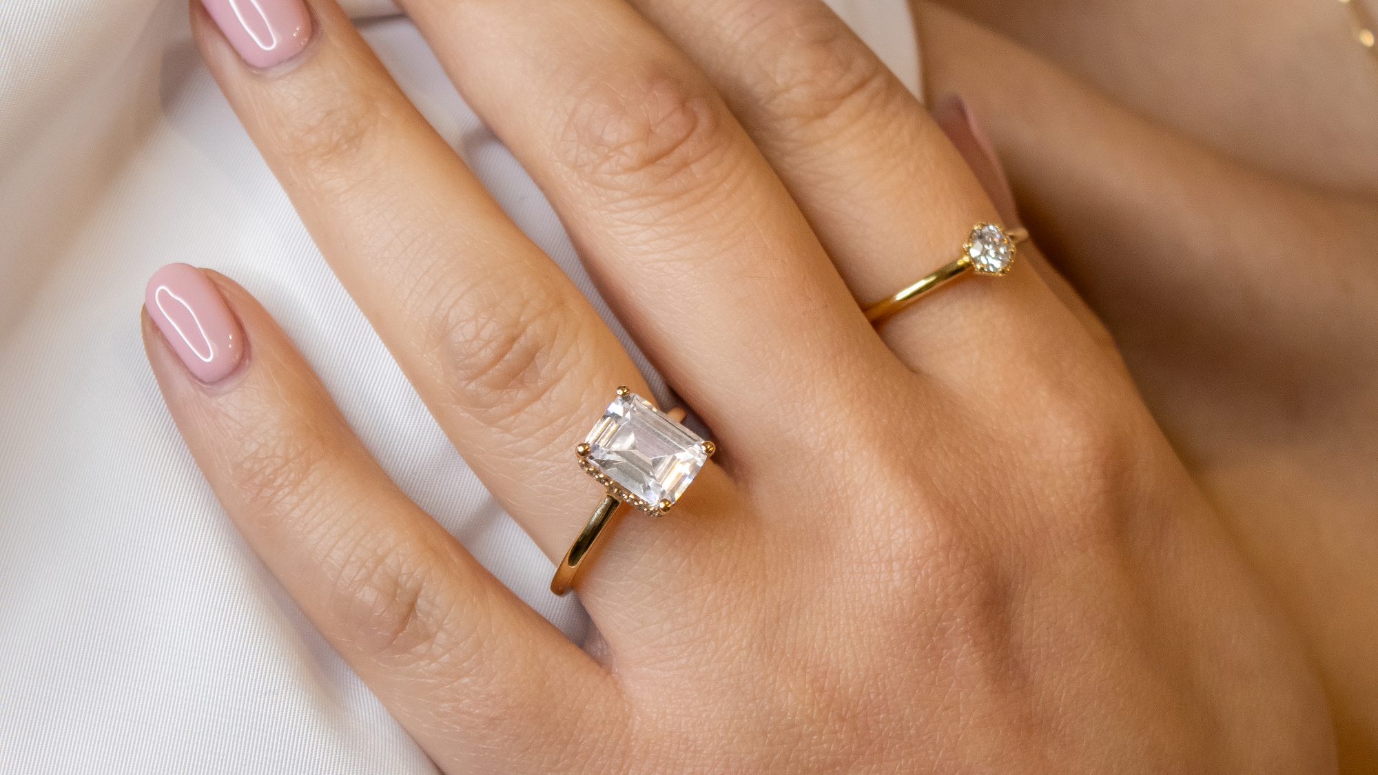 The Casey Hidden Halo diamond engagement ring in yellow gold on model | Lisa Robin