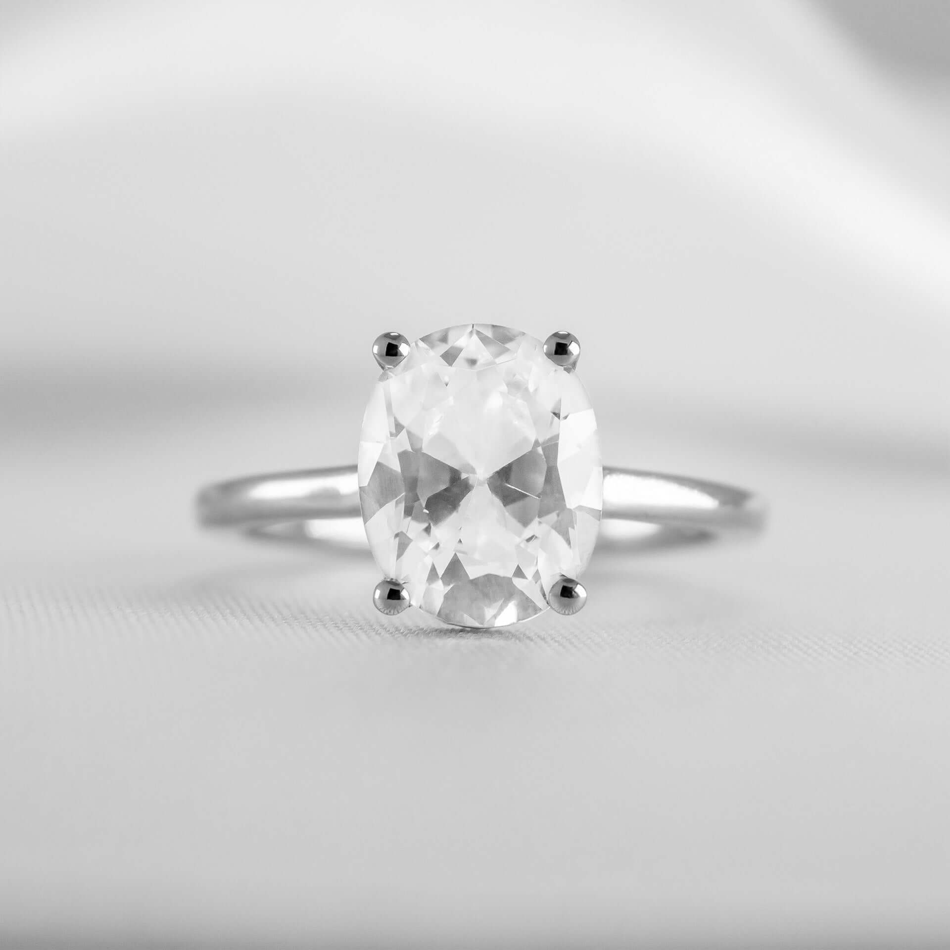 Shown in 1.8 Carat Diamond*The Casey Hidden Halo Emerald Diamond Engagement Ring with oval cut diamond in white gold from front by Lisa Robin#color_14k-white-gold#shape_oval