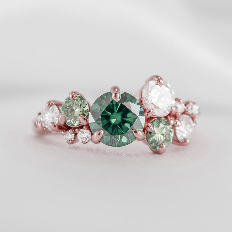 The Chloe Emerald Center and Diamond and Emerald Accent Cluster Engagement Ring in rose gold | Lisa Robin