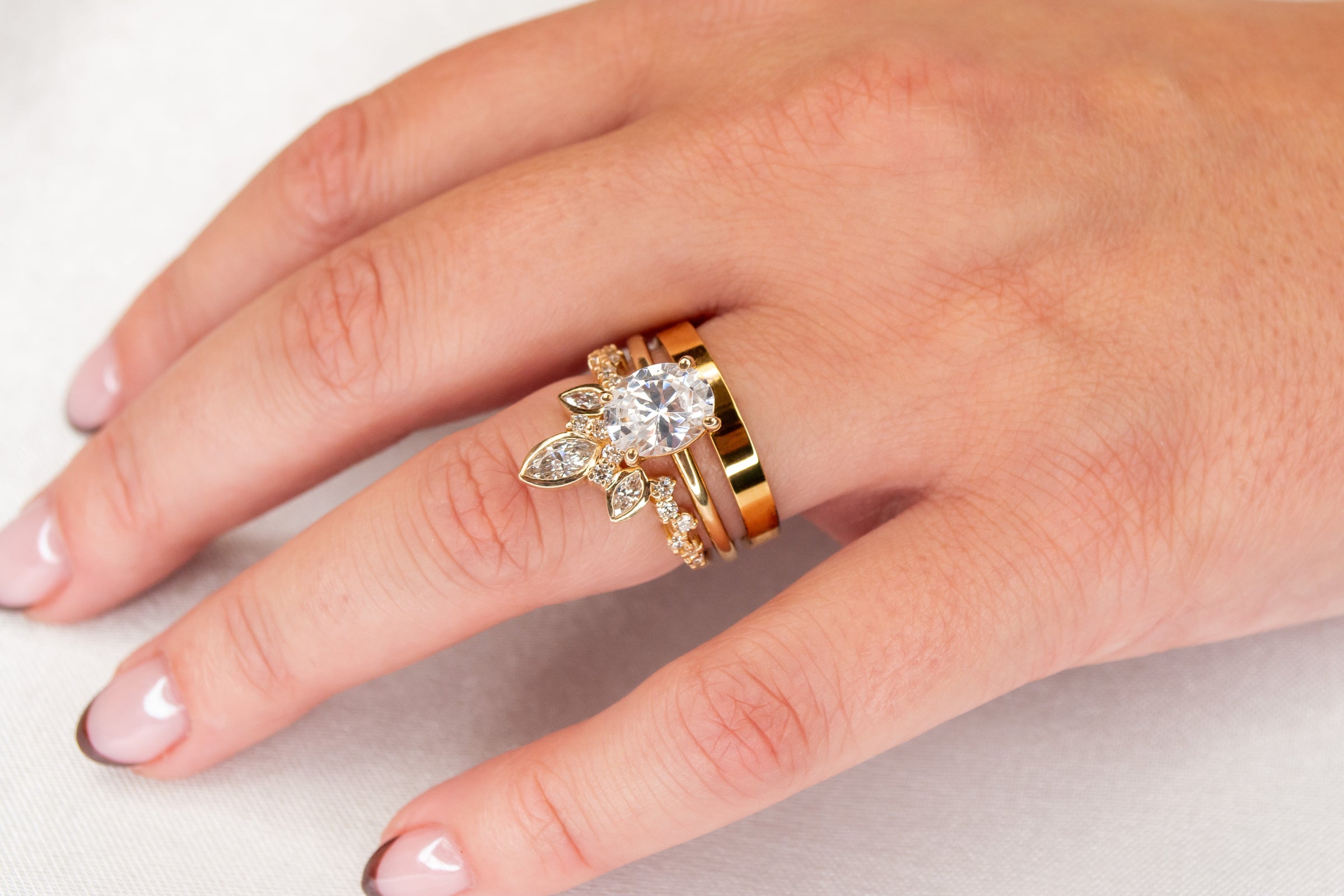 Custom rejewl wedding ring stack in yellow gold on model | Lisa Robin