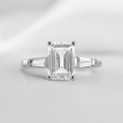 Shown in 1.0 carat * The Devon Three Stone Engagement Ring with Baguettes#shape_emerald