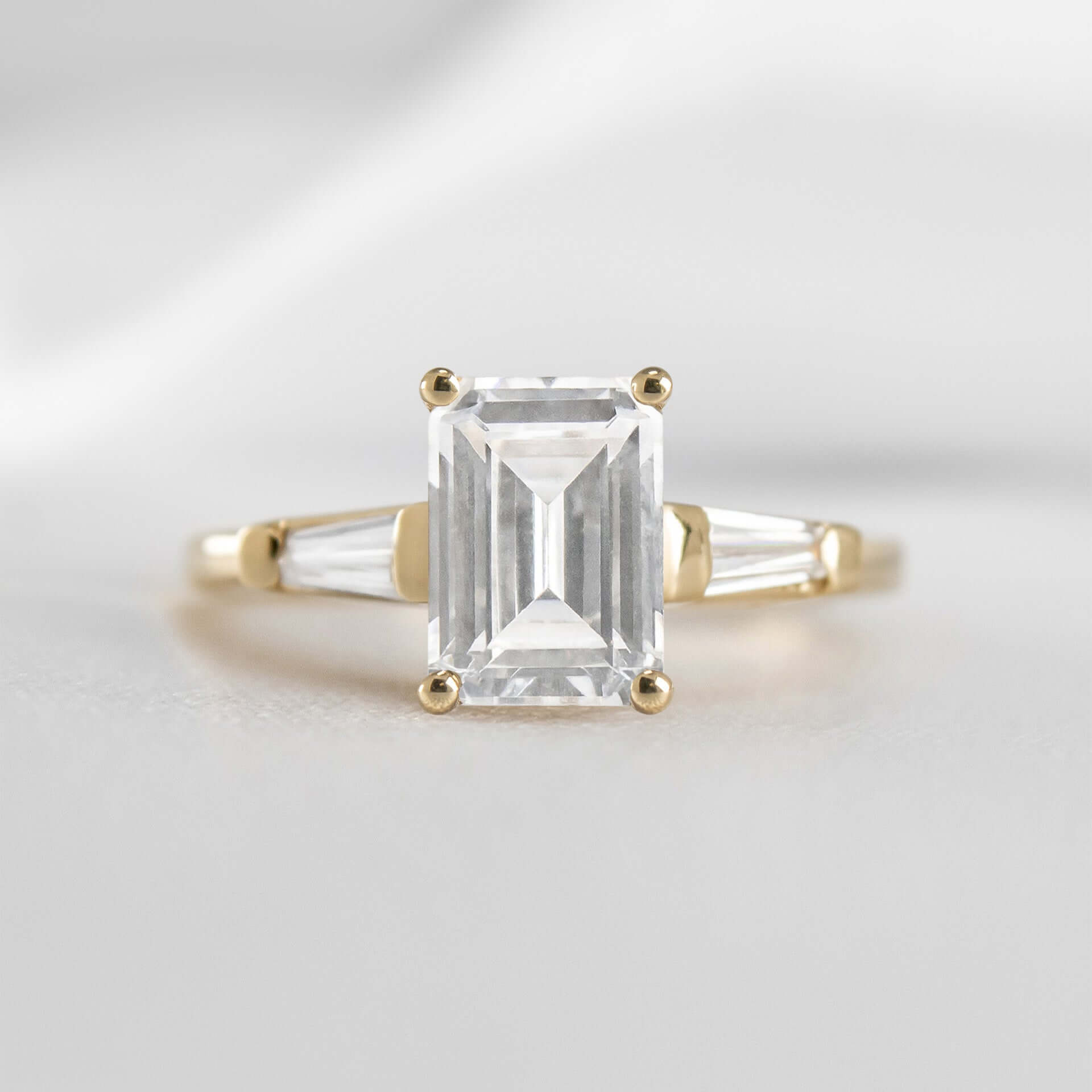 Shown in 1.0 carat * The Devon Three Stone Engagement Ring with Baguettes#shape_emerald