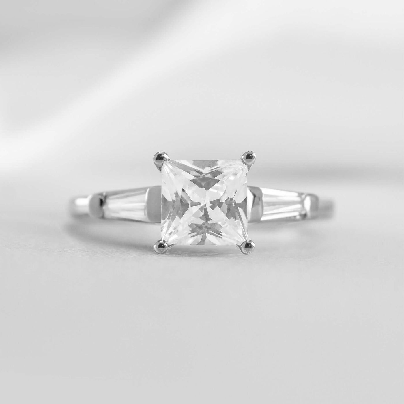 Shown in 1.0 carat * The Devon Three Stone Engagement Ring with Baguettes#shape_princess