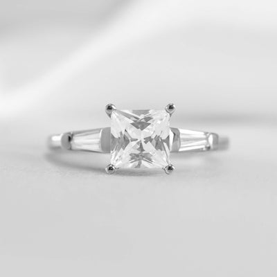 Shown in 1.0 carat * The Devon Three Stone Engagement Ring with Baguettes#shape_princess