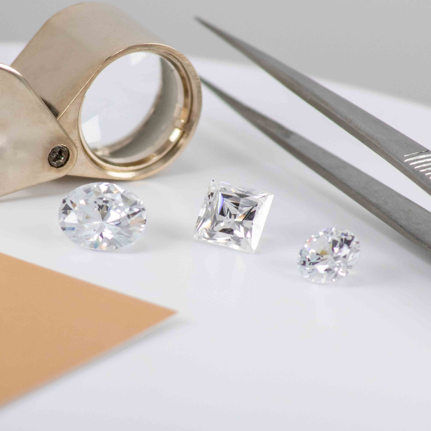 Diamonds with loupe and tweezers | Lisa Robin