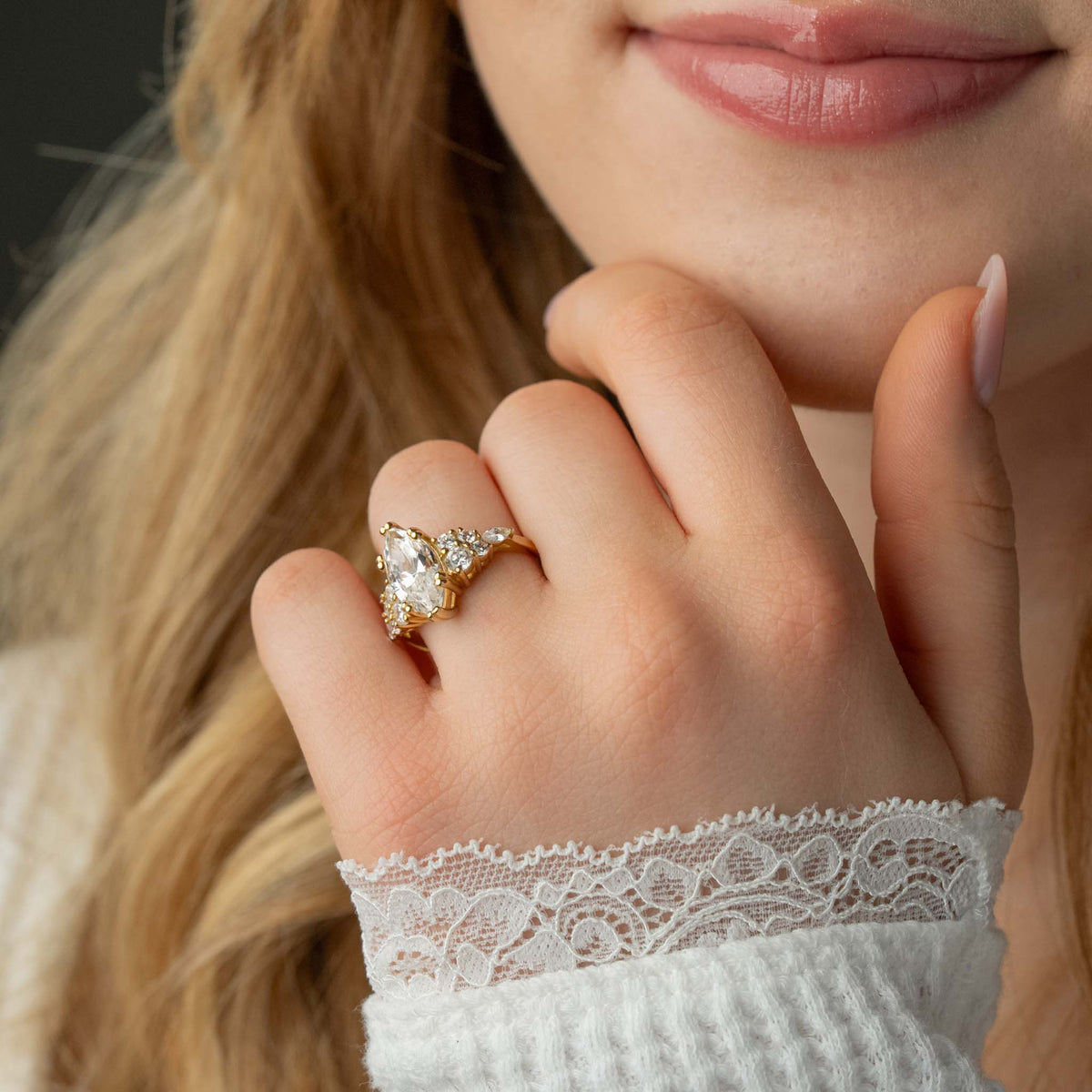 Model wearing the Dorothy2 carat marquise diamond cluster engagement ring by Lisa Robin