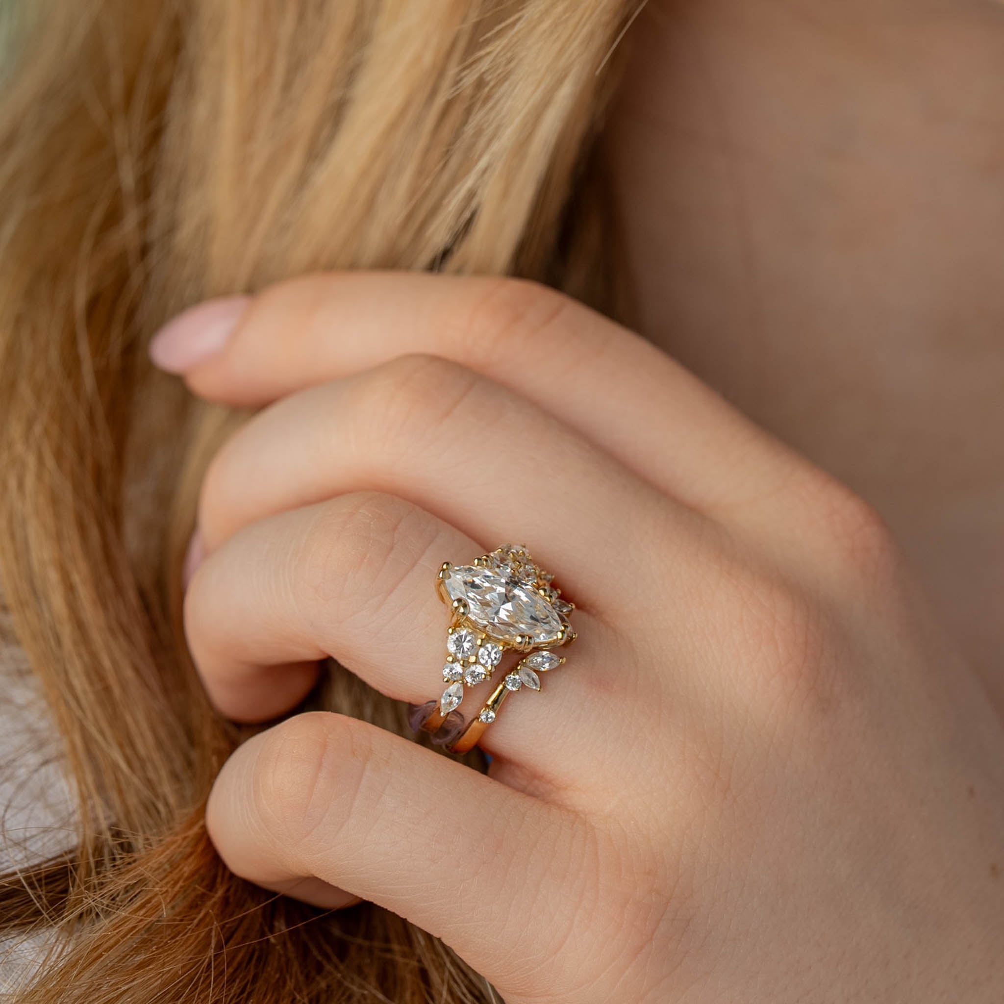 Shown in 2 Carat Diamond*The Dorothy Cluster Double Prong Engagement Ring with marquise cut diamond in yellow gold on model hand by Lisa Robin#color_14k-yellow-gold