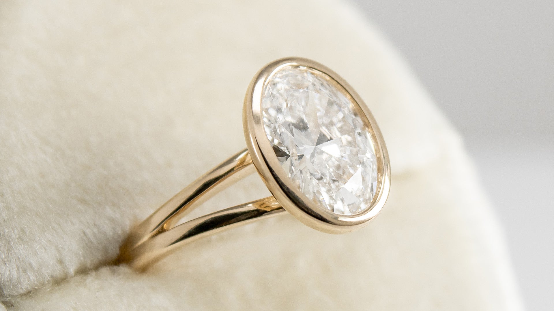 The Emery bezel Set Oval Diamond Ring In Yellow Gold | Lisa Robin