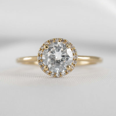 Shown  in 1.0 Carat * The Emma Round Diamond Halo Engagement Ring in yellow Gold | Lisa Robin#color_18k-yellow-gold