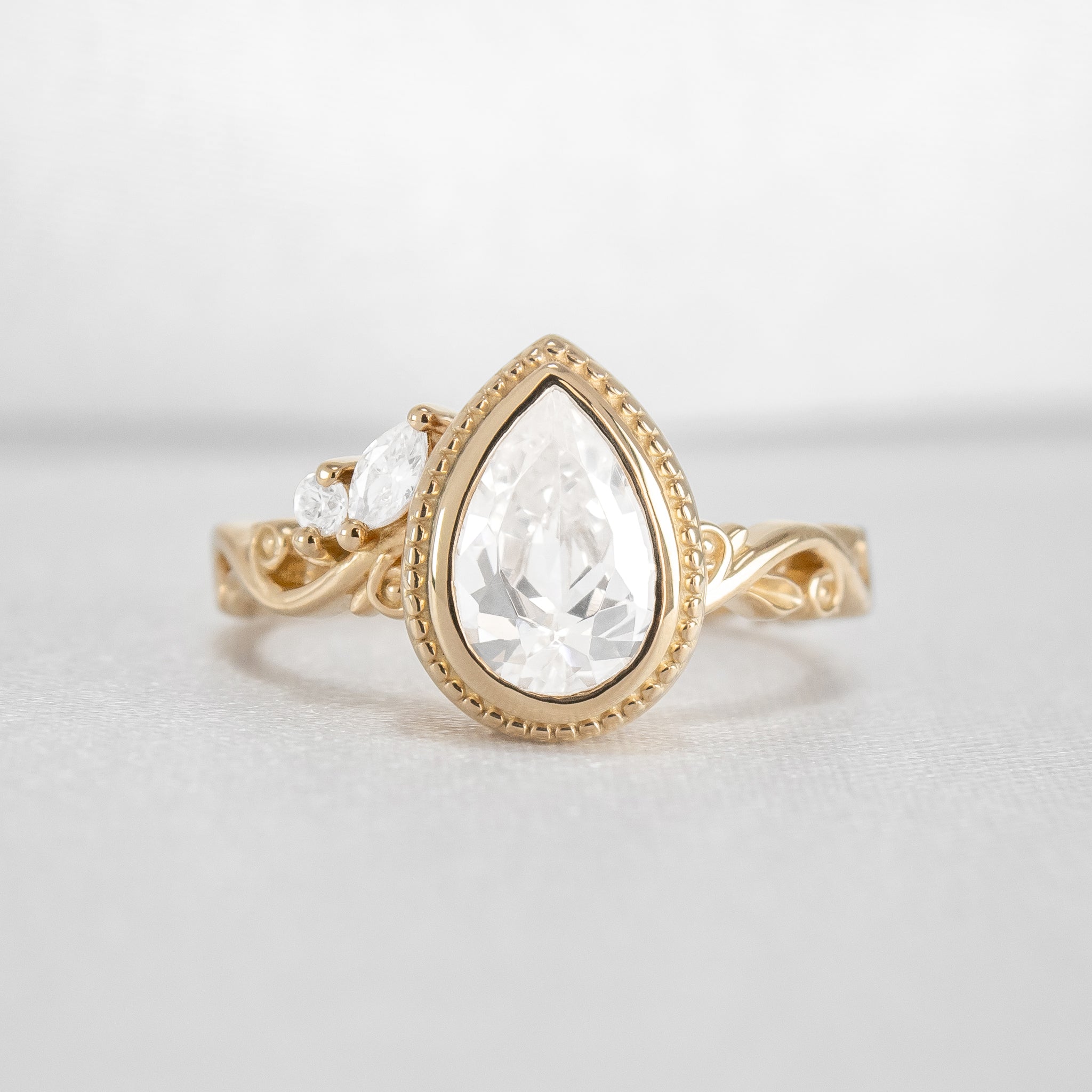 Shown in 2 Carat Diamond*The Fable victorian style bezel Engagement Ring with pear cut diamond in yellow gold from front by Lisa Robin#color_14k-yellow-gold