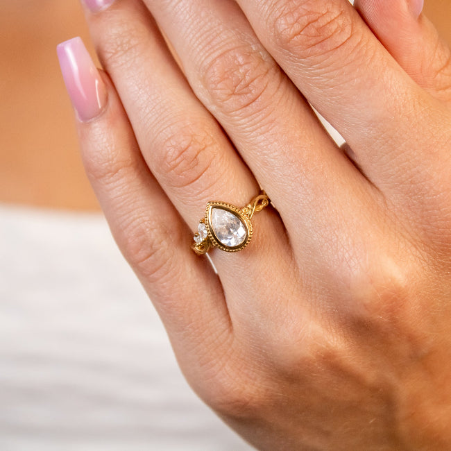 Shown in 2 Carat Diamond*The Fable victorian style bezel Engagement Ring with pear cut diamond in yellow gold on model hand by Lisa Robin#color_14k-yellow-gold