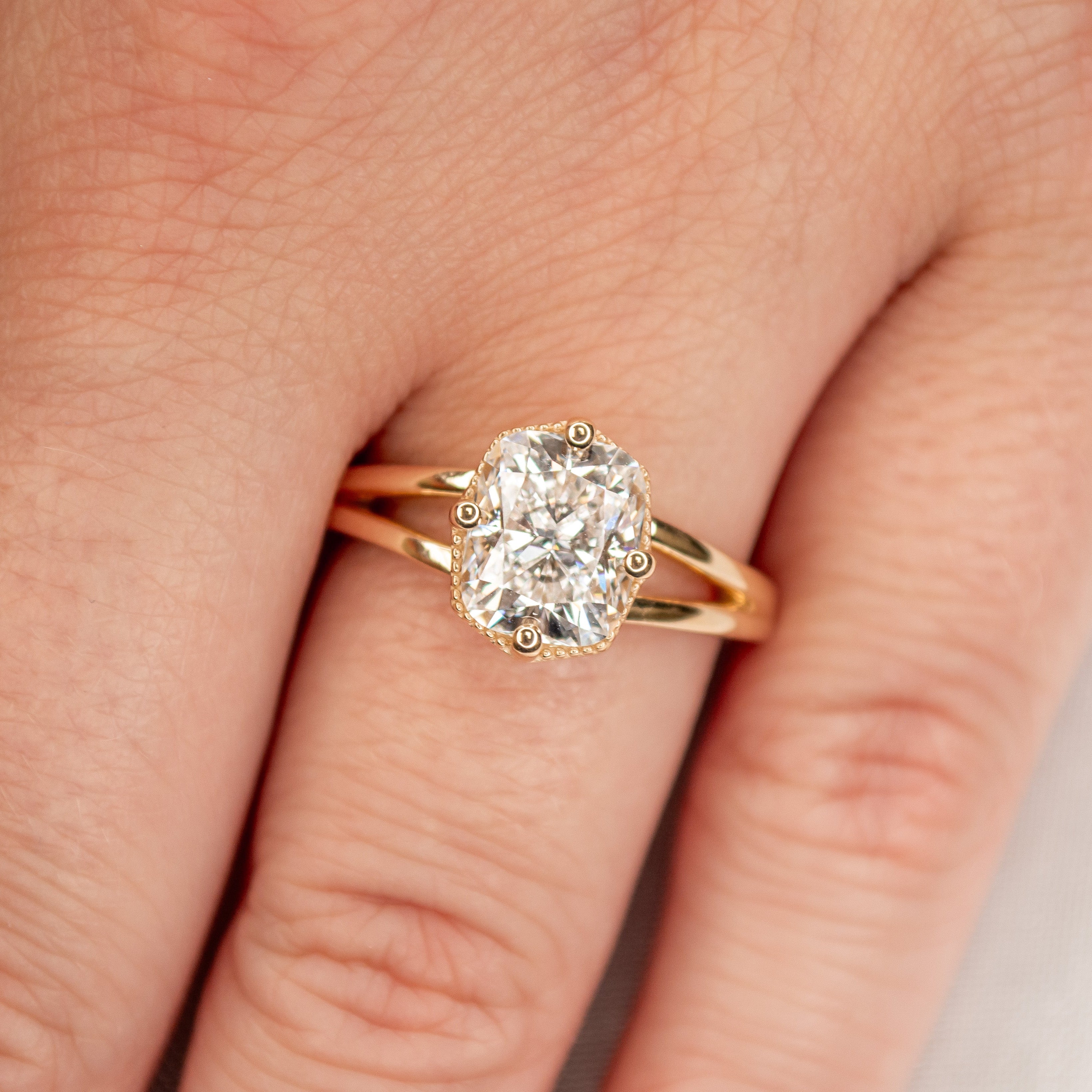 Shown in 1.5 Carat Diamond*The Gabriella Octagon Engagement Ring with emerald cut diamond in yellow gold on model hand by Lisa Robin#color_14k-yellow-gold