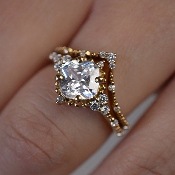 Shown in 2 Carat Diamond*The Galaeth Cluster Diamond Engagement Ring with cushion cut diamond in yellow gold with the Maeve curved lab diamond 14K yellow gold wedding band on model hand by Lisa Robin#color_14k-yellow-gold