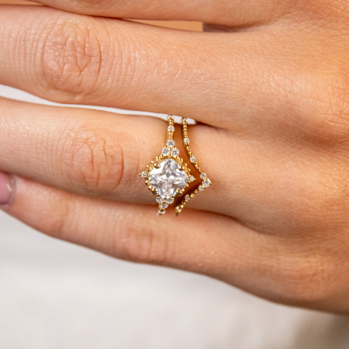 Shown in 2 Carat Diamond*The Galaeth Cluster Diamond Engagement Ring with cushion cut diamond in yellow gold with the Maeve curved lab diamond 14K yellow gold wedding band by Lisa Robin Jewelry