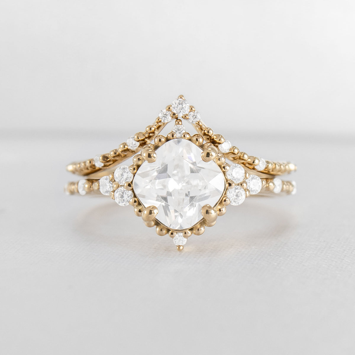Shown in 2 Carat Diamond*The Galaeth Cluster Diamond Engagement Ring with cushion cut diamond in yellow gold with the Maeve curved lab diamond 14K yellow gold wedding band by Lisa Robin#color_14k-yellow-gold