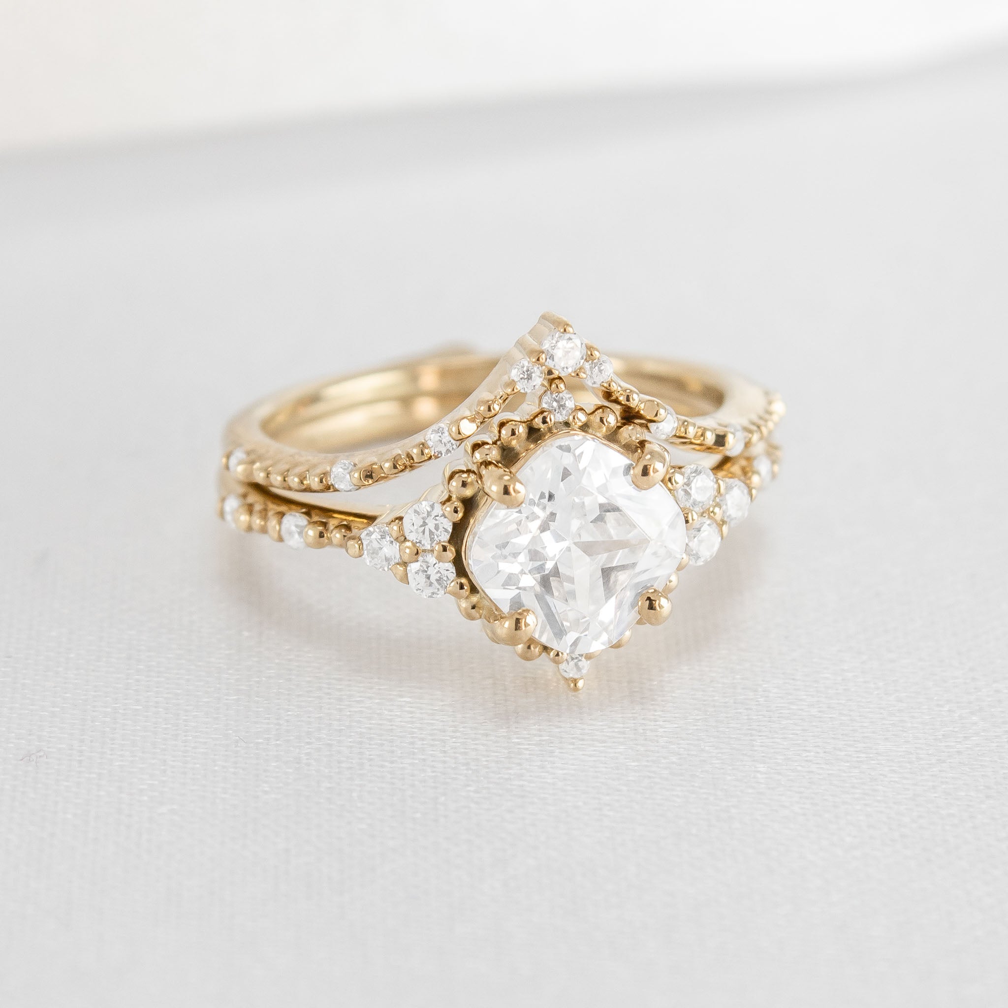 Shown in 2 Carat Diamond*The Galaeth Cluster Diamond Engagement Ring with cushion cut diamond in yellow gold with the Maeve curved lab diamond 14K yellow gold wedding band from top view by Lisa Robin#color_14k-yellow-gold