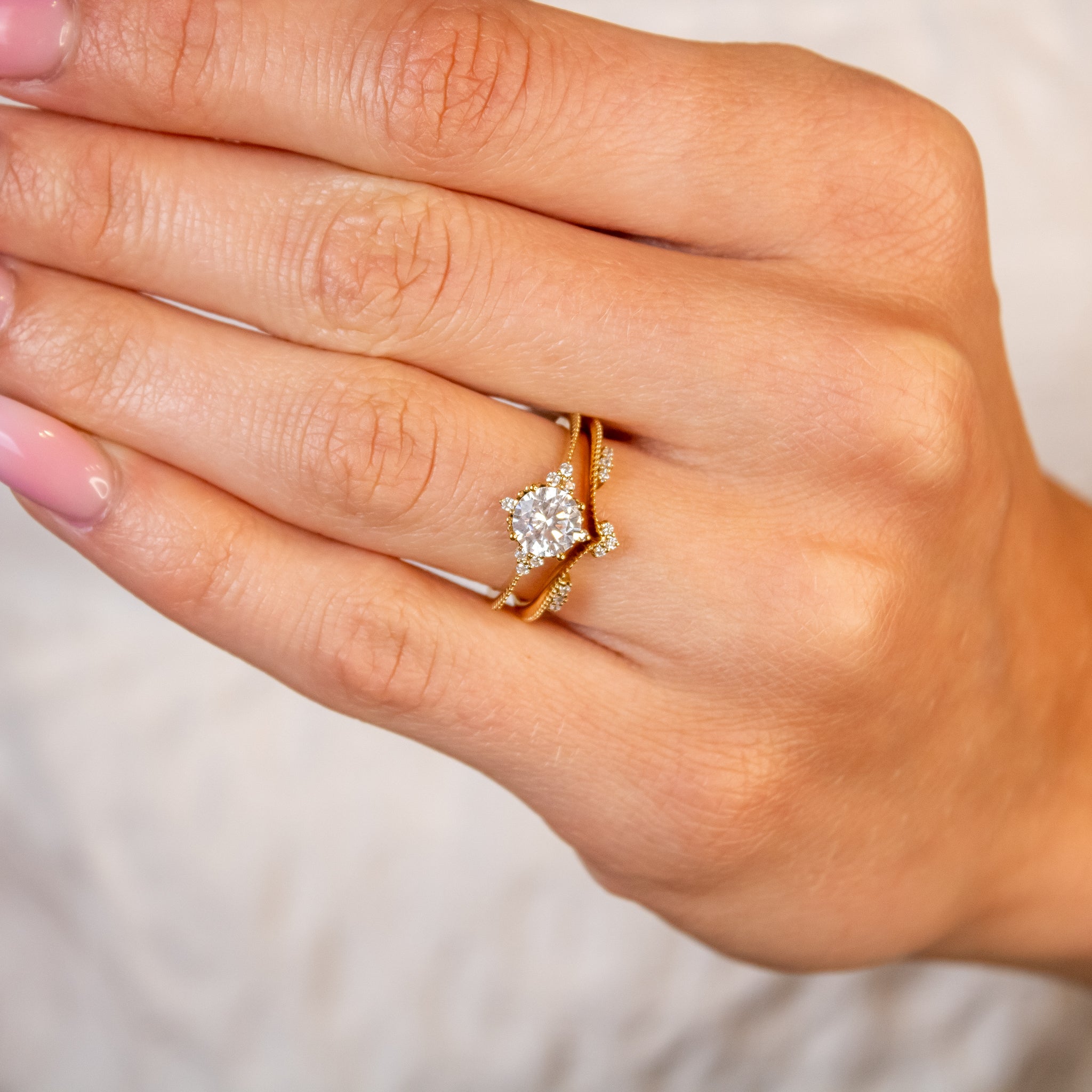 Shown in 1 Carat Diamond*The galaxy cluster Engagement Ring with round cut diamond in yellow gold on model hand by Lisa Robin#color_14k-yellow-gold