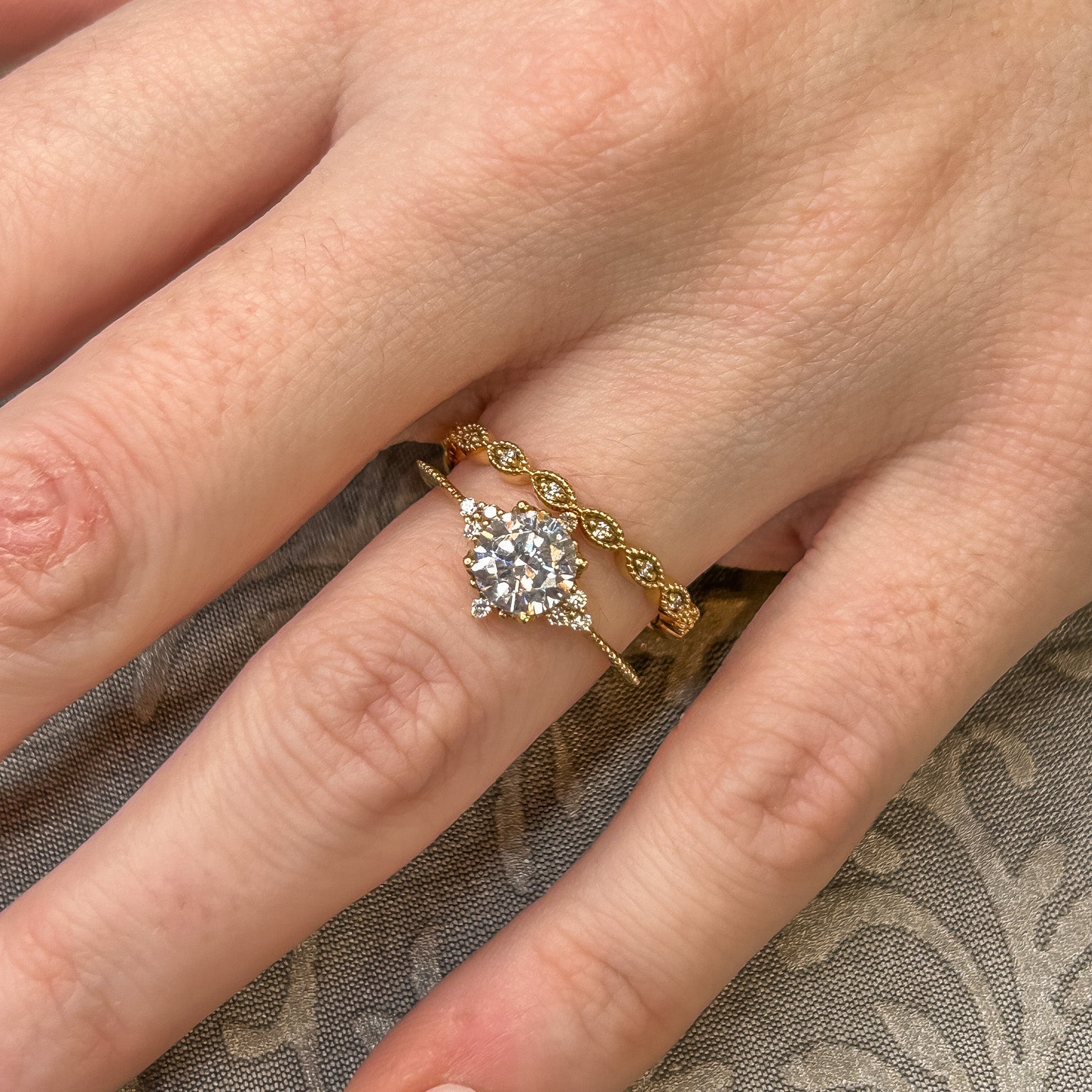 Shown in 1 Carat Diamond*The galaxy cluster Engagement Ring with round cut diamond in yellow gold on model hand by Lisa Robin#color_14k-yellow-gold