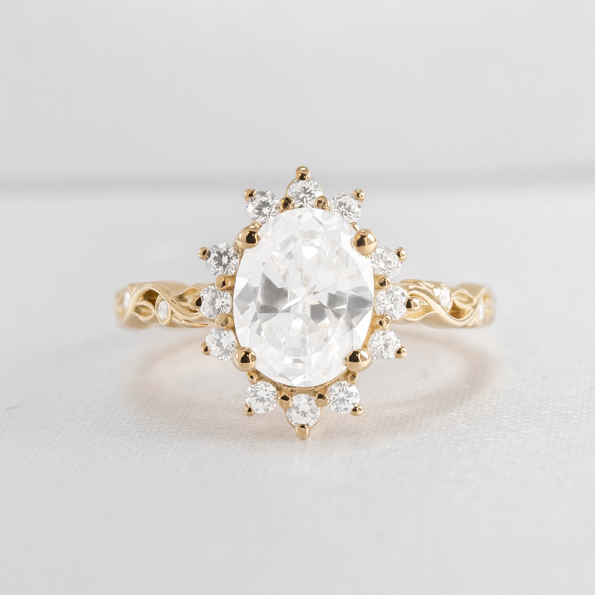 Shown in 1 Carat Diamond*The Ivy Leaf and Vine Halo Diamond Engagement Ring with oval cut diamond in yellow gold from front by Lisa Robin#color_14k-yellow-gold