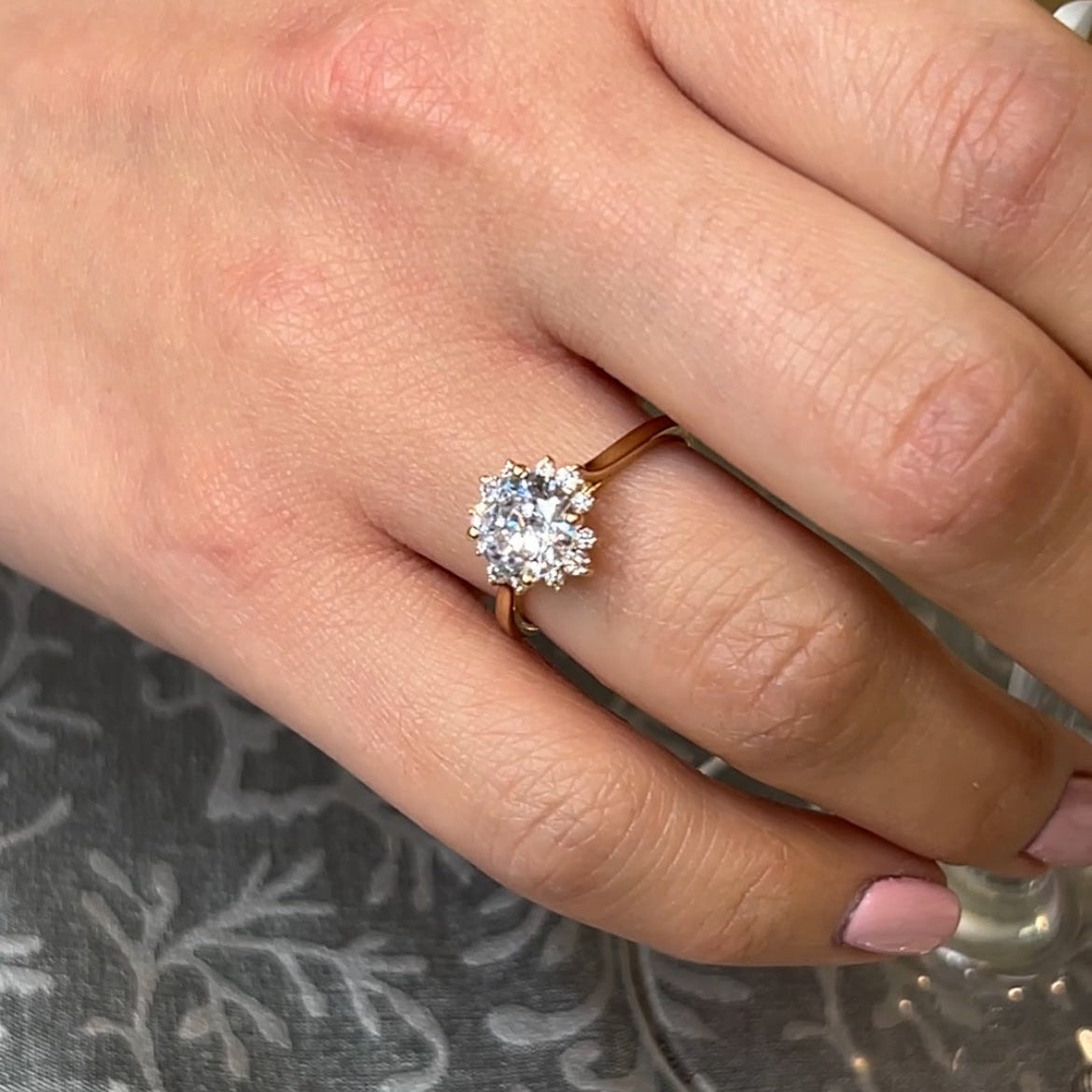 Shown in 1.5 Carat Diamond*The Jaylin Floral Halo Engagement Ring with round cut diamond in yellow gold on model hand by Lisa Robin#color_14k-yellow-gold